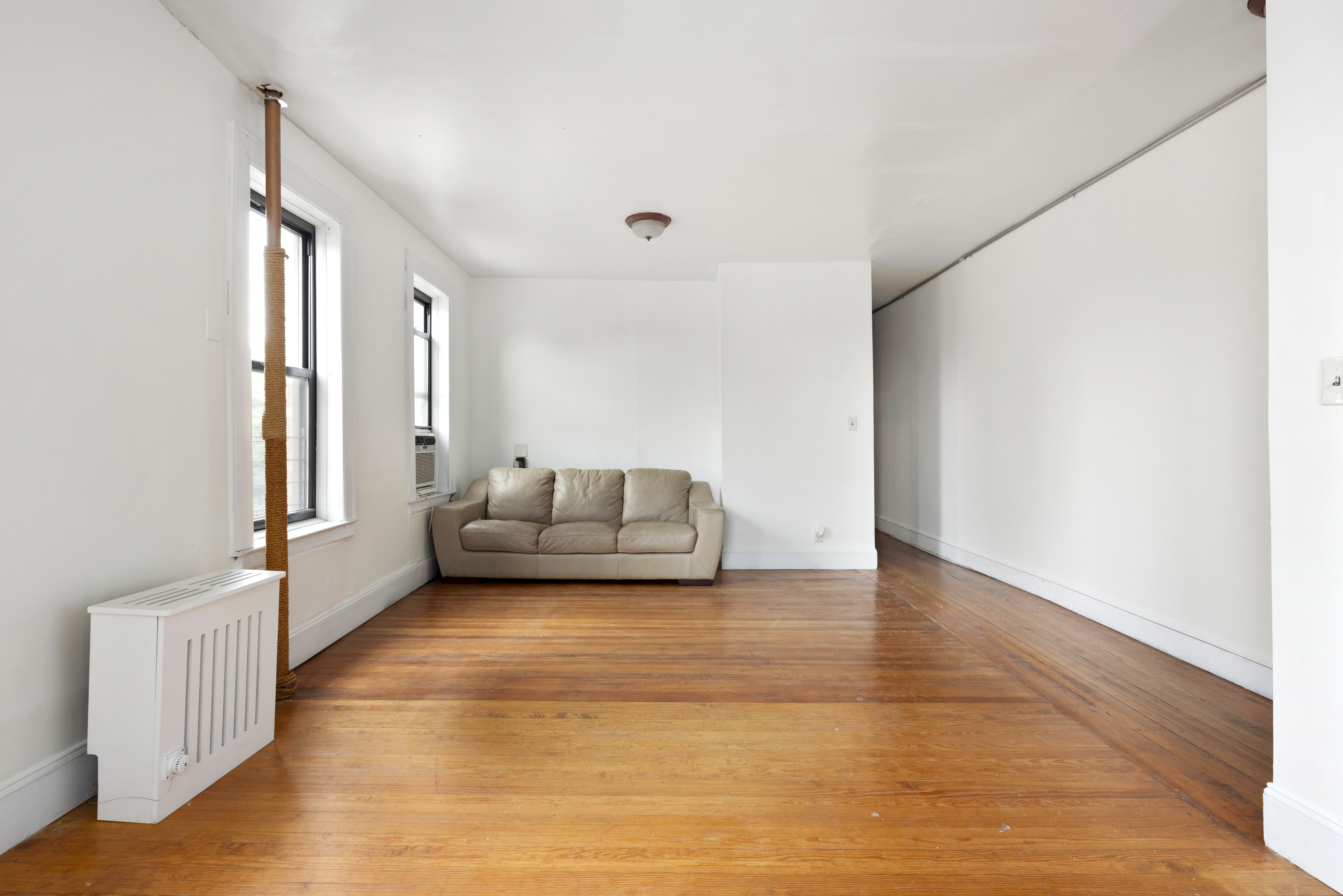 501 West 156th Street, Unit 44 Manhattan, NY 10032 - Photo 2 of 8 a living room with furniture and a rug