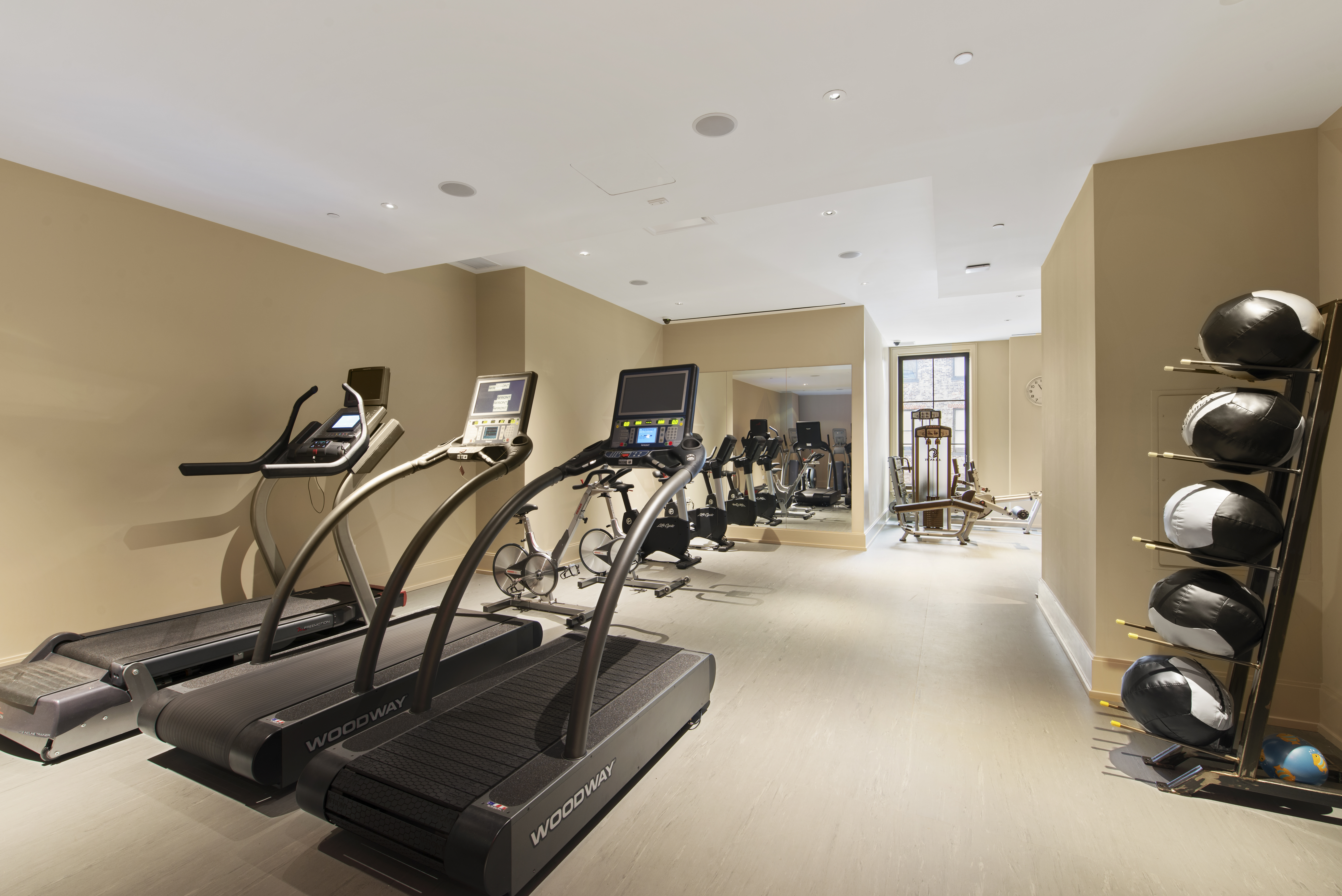 212 West 18th Street, Unit 12E Manhattan, NY 10011 - Photo 9 of 13 a view of a room with gym equipment