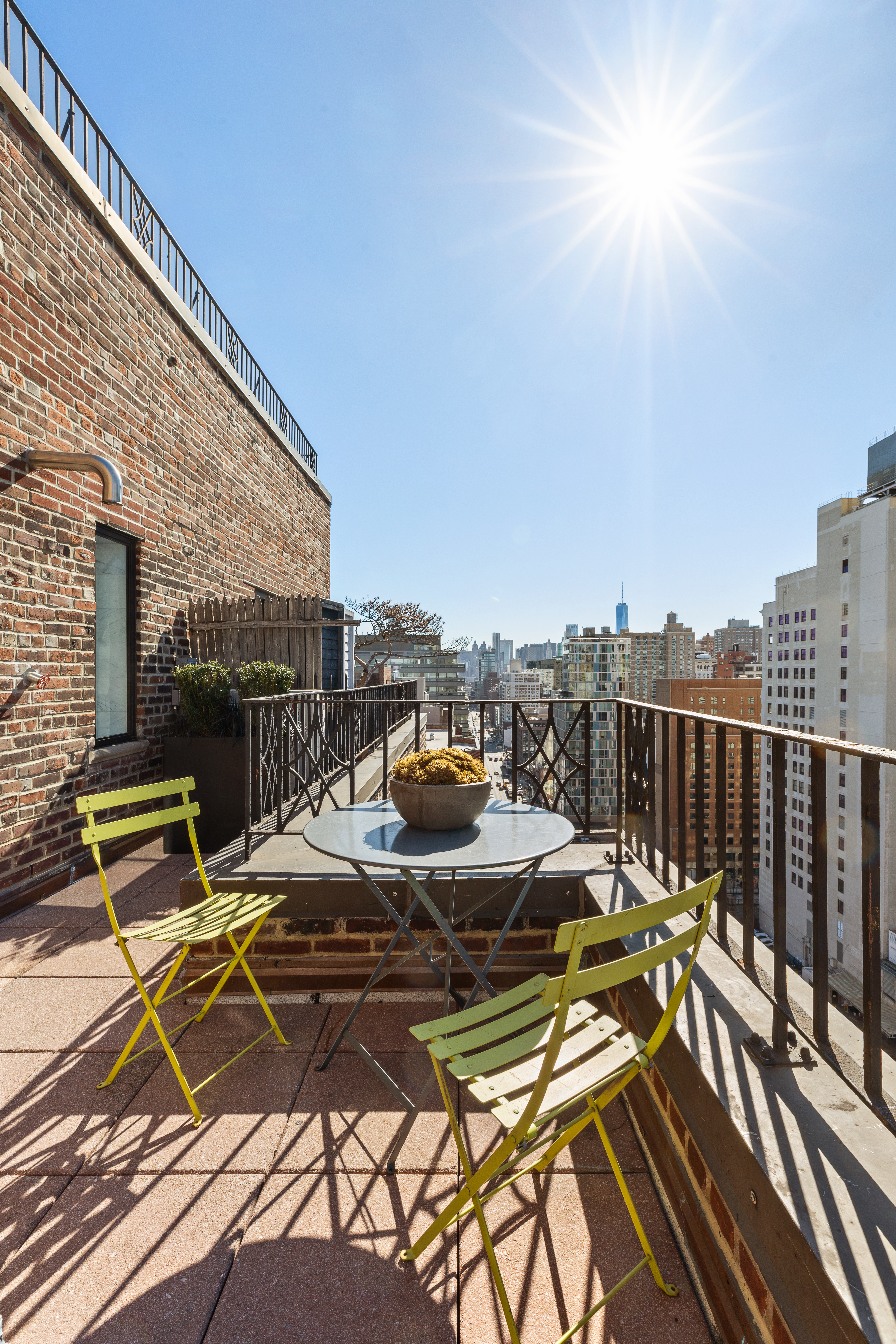 200 East 16th Street, Unit PHC Manhattan, NY 10003 - Photo 6 of 9 a view of a patio with chairs and table on the terrace