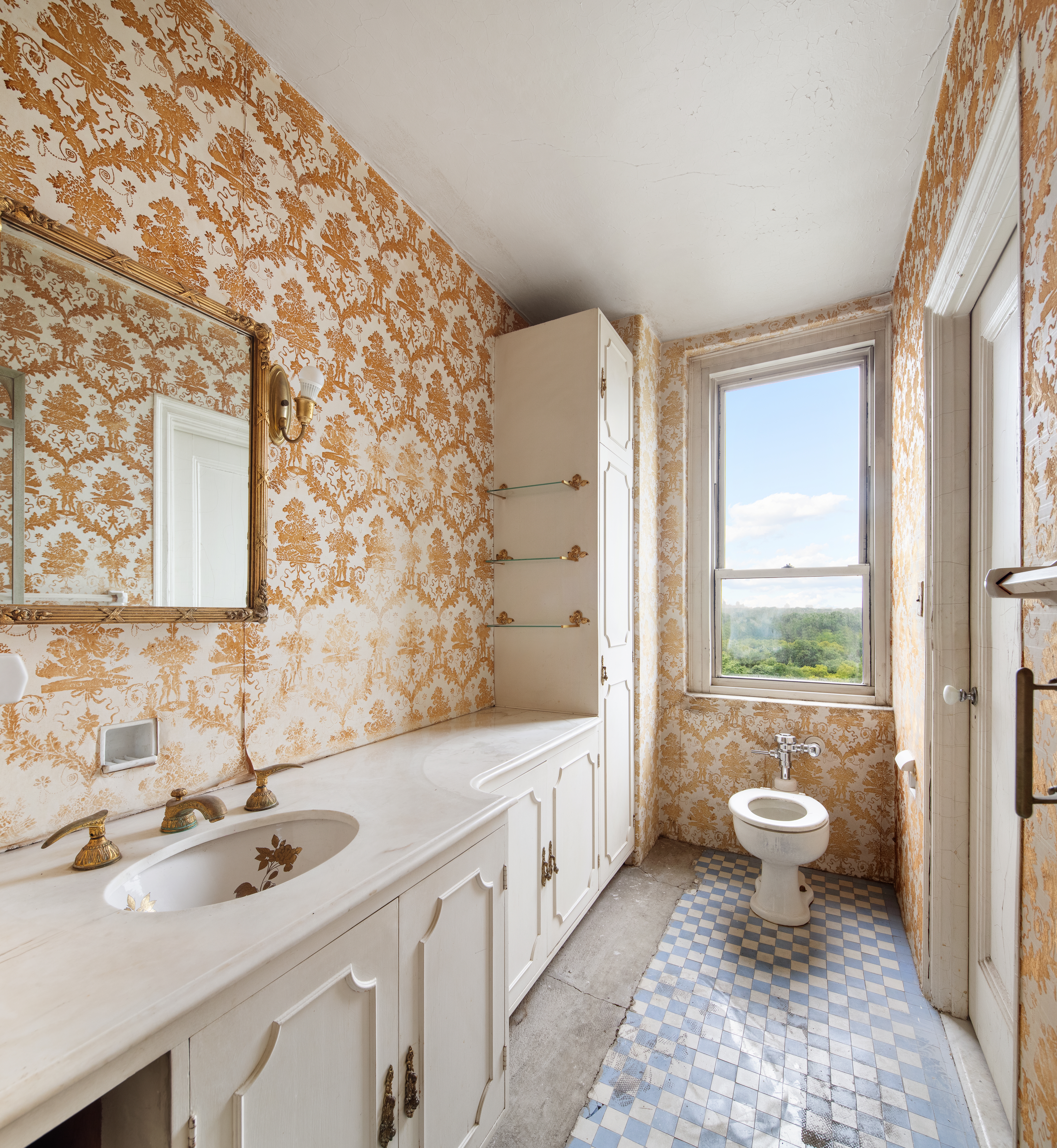 128 Central Park South, Unit 13A Manhattan, NY 10019 - Photo 6 of 10 a bathroom with a double vanity sink toilet and a tub