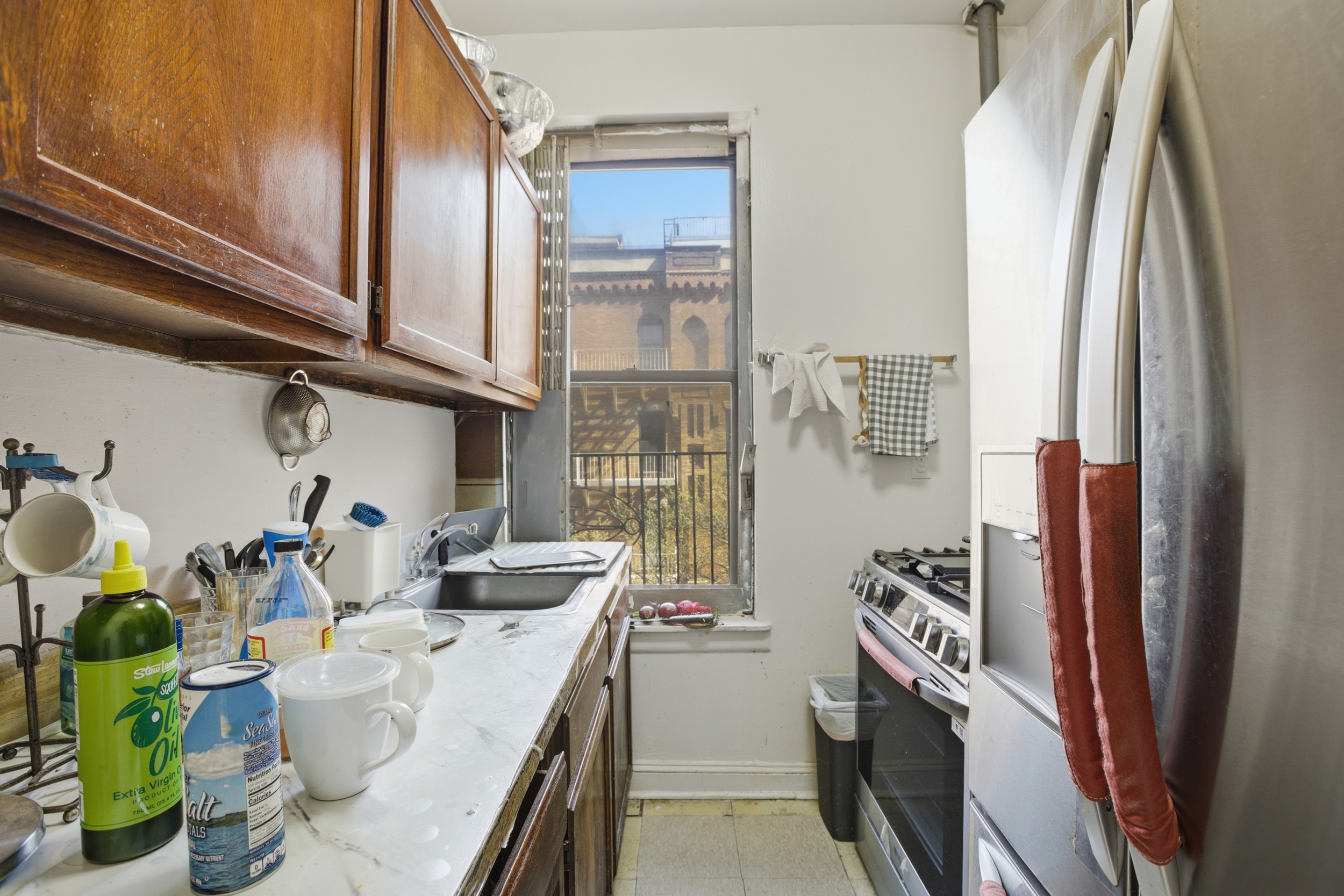 1809 Adam Clayton Powell Jr Boulevard, Unit 2D Manhattan, NY 10026 - Photo 2 of 15 a kitchen with stainless steel appliances granite countertop a refrigerator and a stove