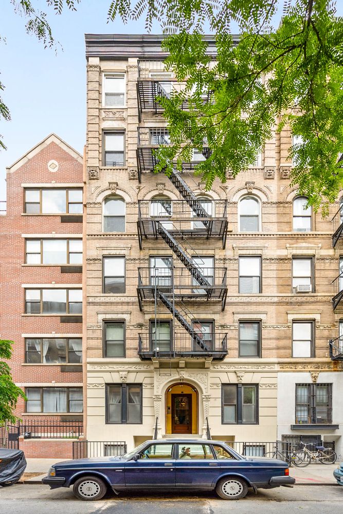 71 East 3rd Street, Unit 4 Manhattan, NY 10003 - Photo 14 of 18 a front view of a building with balcony