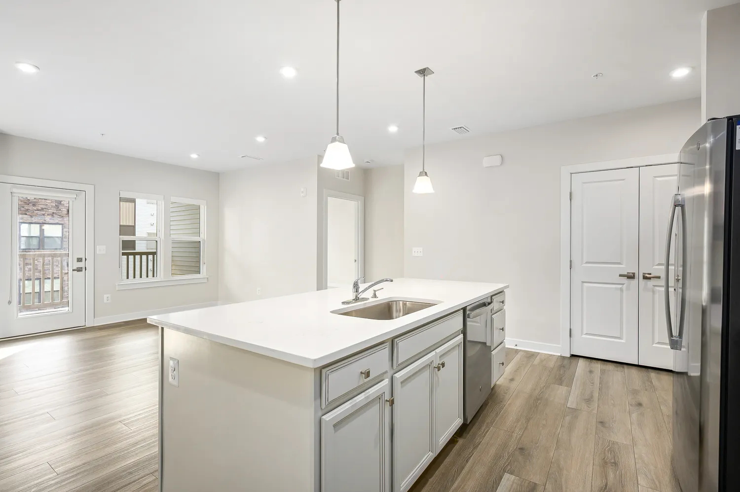 a kitchen with a sink and window