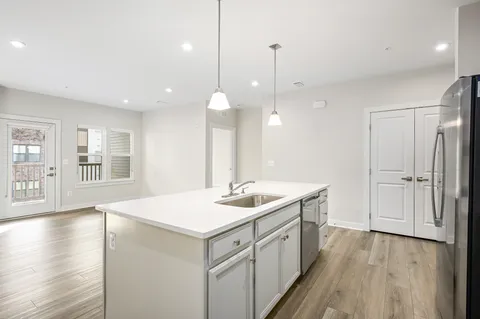 a kitchen with a sink and window