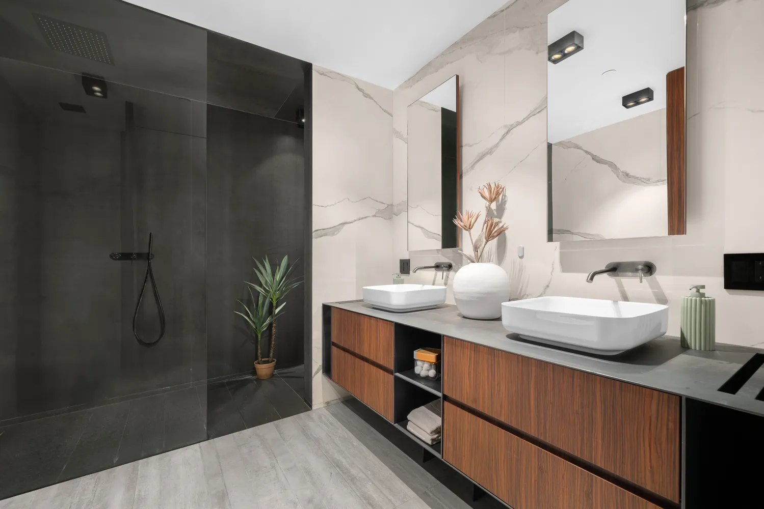a bathroom with a double vanity sink and mirror
