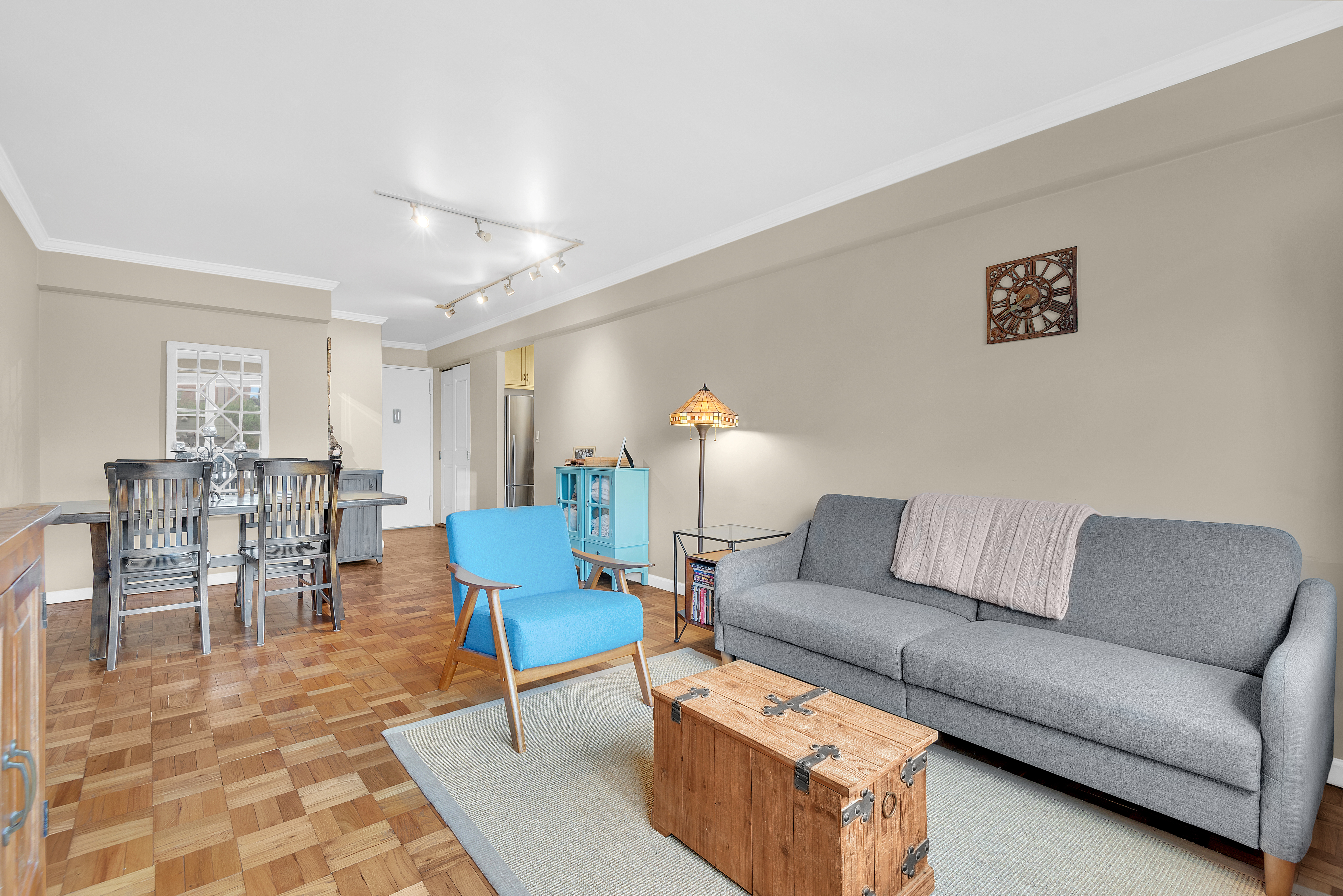 445 East 86th Street, Unit 6D Manhattan, NY 10028 - Photo 2 of 11 a living room with furniture and a dining table with rug