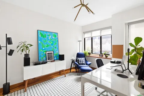 a living room with furniture and window