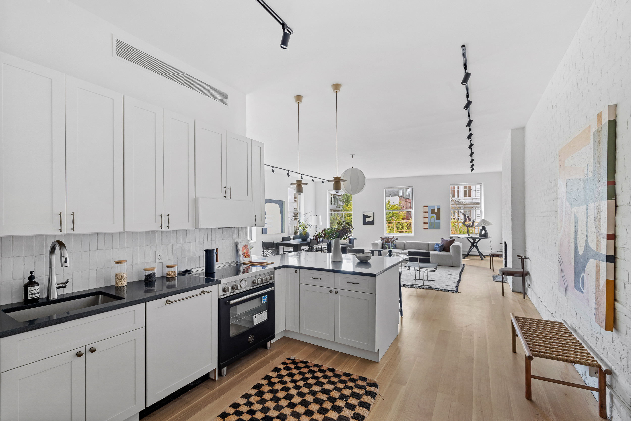 325 Bowery, Unit 3 Manhattan, NY 10003 - Photo 6 of 14 a kitchen with lots of counter top space and cabinets