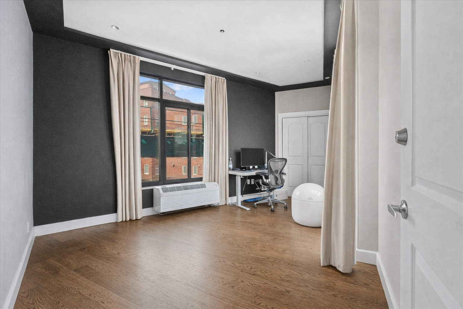 83 Suydam Street, Unit TWOFAMILY Brooklyn, NY 11221 - Photo 4 of 11 a view of a livingroom with a patio and a window
