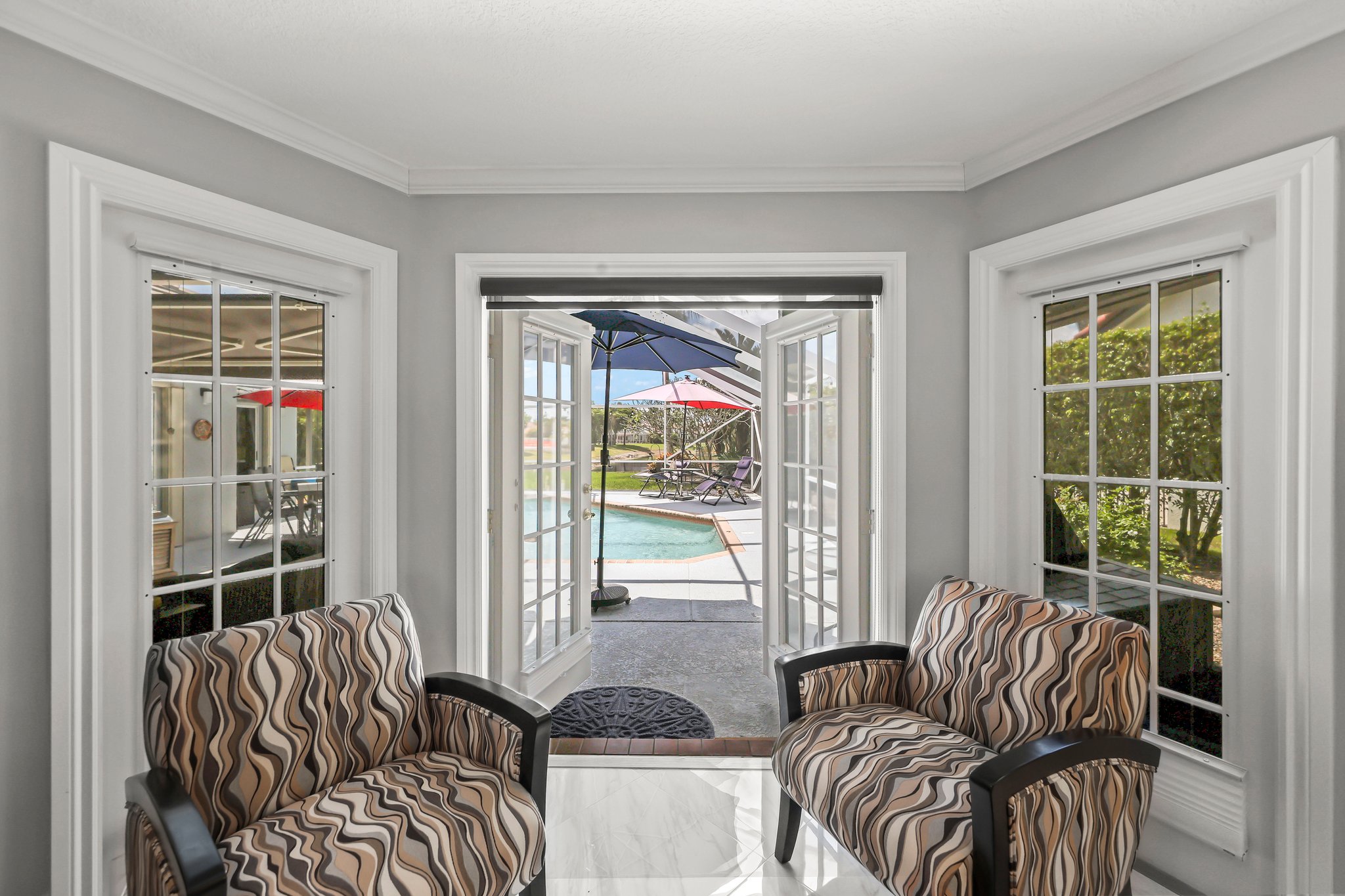 20317 Hacienda Court Boca Raton, FL 33498 - Photo 30 of 100 a living room with furniture and a large window