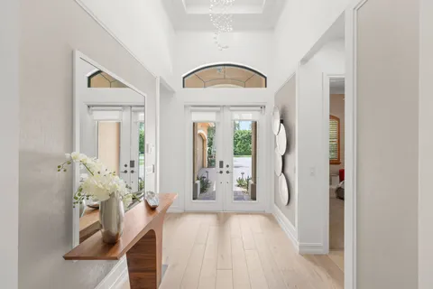 a view of an entryway with wooden floor