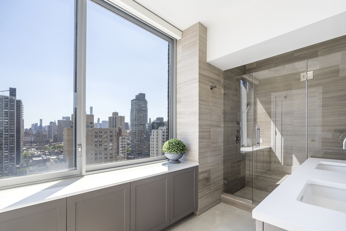 360 East 88th Street, Unit 20D Manhattan, NY 10128 - Photo 6 of 15 a bathroom with a bathtub and shower