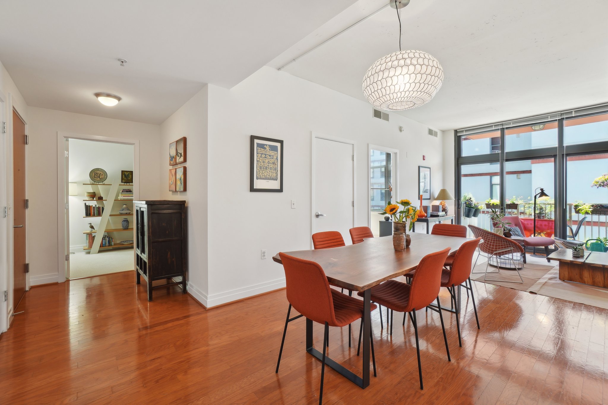 2120 Vermont Avenue Northwest, Unit 309 Washington, DC 20001 - Photo 4 of 26 a view of a dining room with furniture window and wooden floor