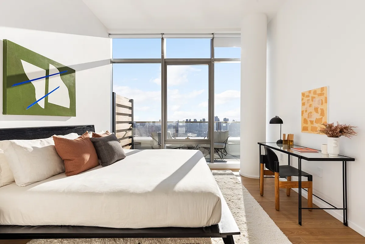 5 South 5th Street, Unit PH2B Brooklyn, NY 11249 - Photo 9 of 27 a bedroom with a bed and a large window