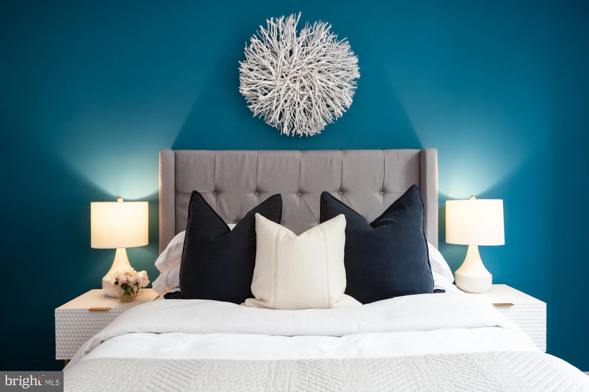 1715 15th Street Northwest, Unit 101 Washington, DC 20009 - Photo 5 of 23 a bedroom with a bed and a lamp