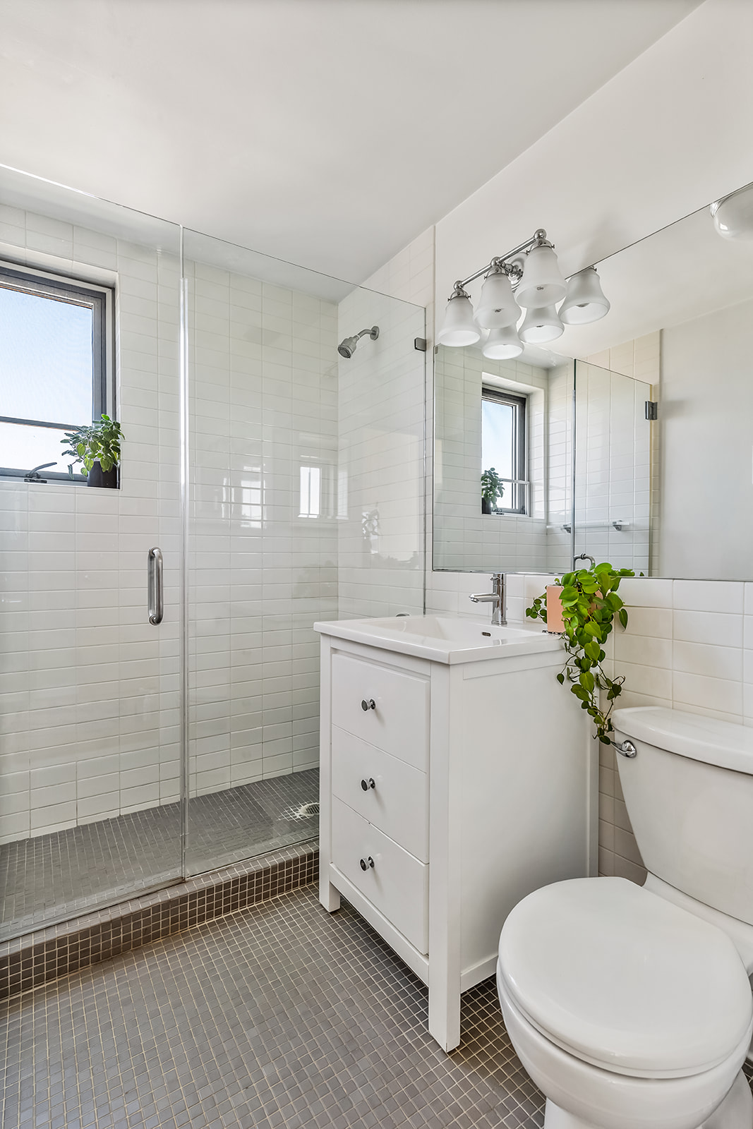 475 Sterling Place, Unit 5E Brooklyn, NY 11238 - Photo 7 of 13 a bathroom with a toilet sink and shower
