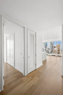 a view of a livingroom with furniture and hardwood floor