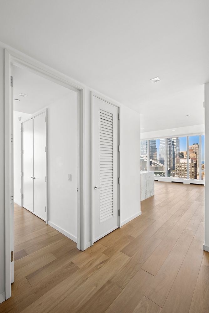 a view of a livingroom with furniture and hardwood floor