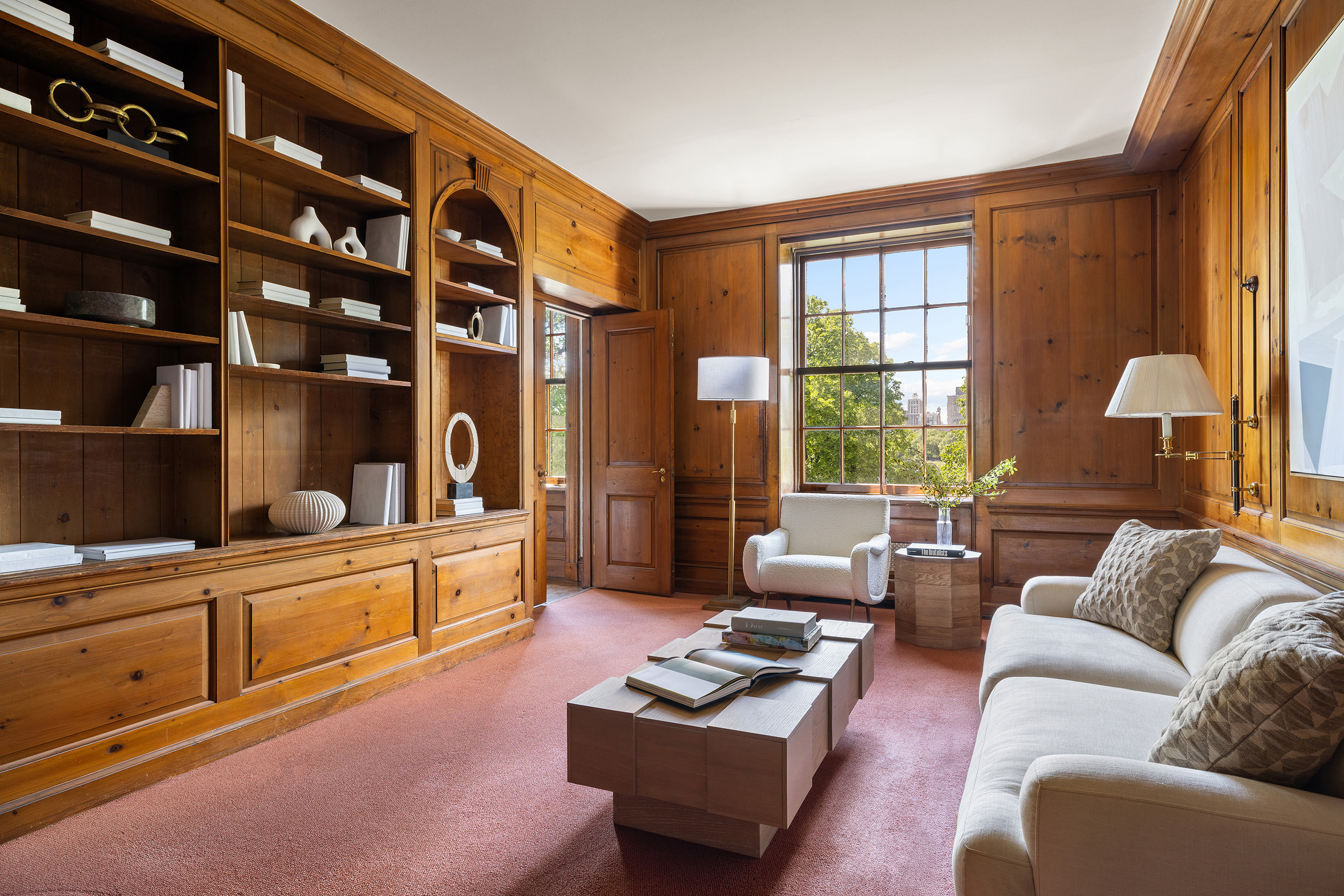 1120 5th Avenue, Unit 7B Manhattan, NY 10128 - Photo 5 of 17 a living room with furniture a rug and a window