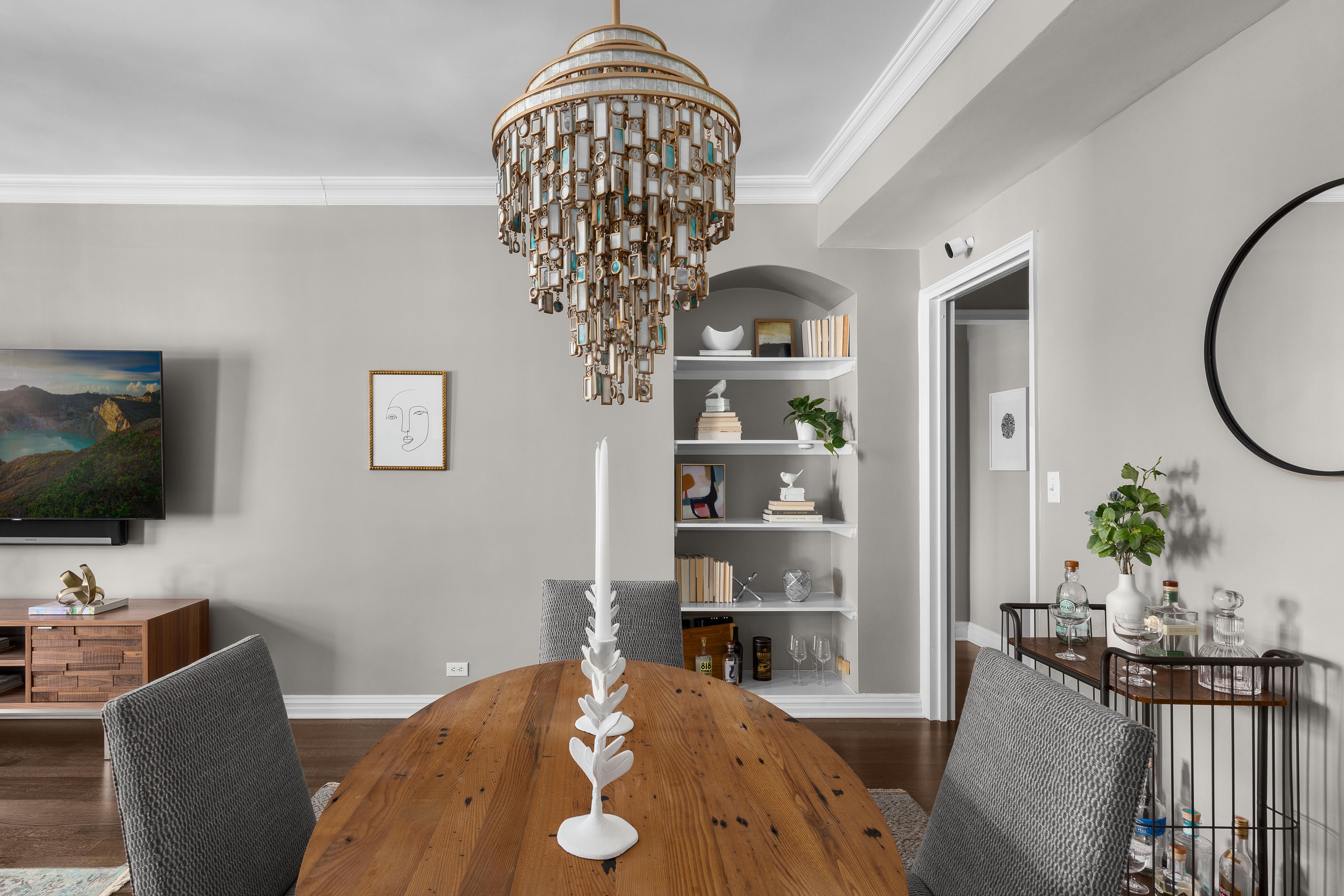 470 West 24th Street, Unit 16H Manhattan, NY 10011 - Photo 6 of 13 a view of a livingroom with furniture and a flat screen tv