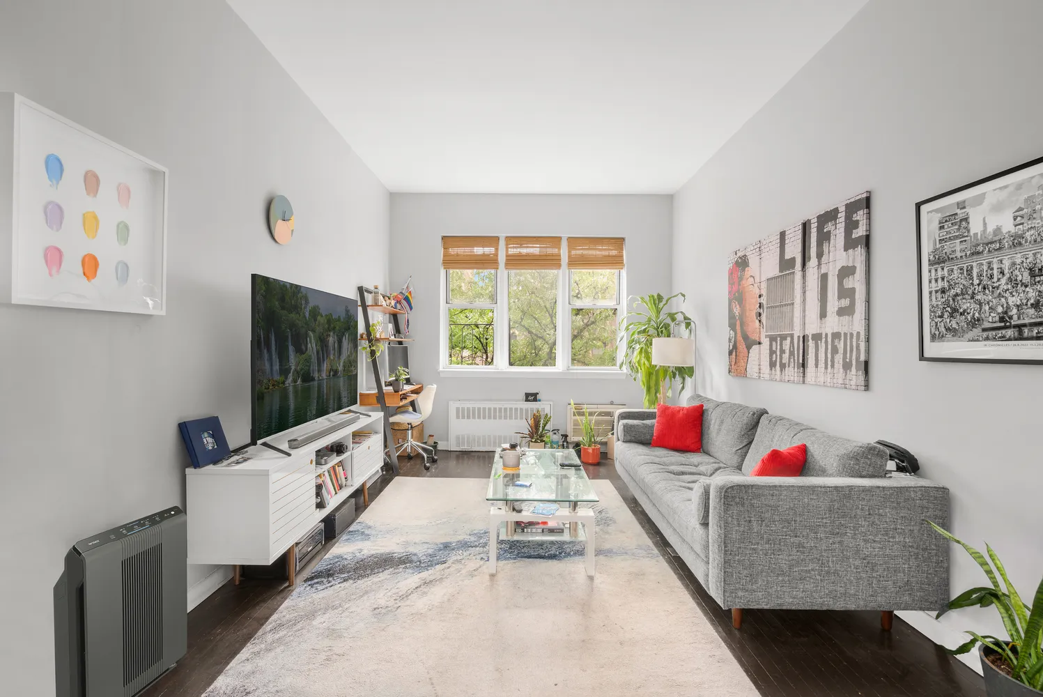 a living room with furniture and a flat screen tv