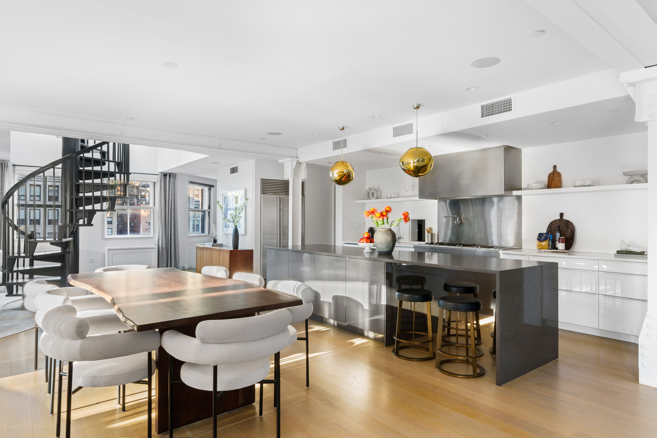 1200 Broadway, Unit PH89 Manhattan, NY 10001 - Photo 6 of 47 a view of a dining room with furniture and wooden floor