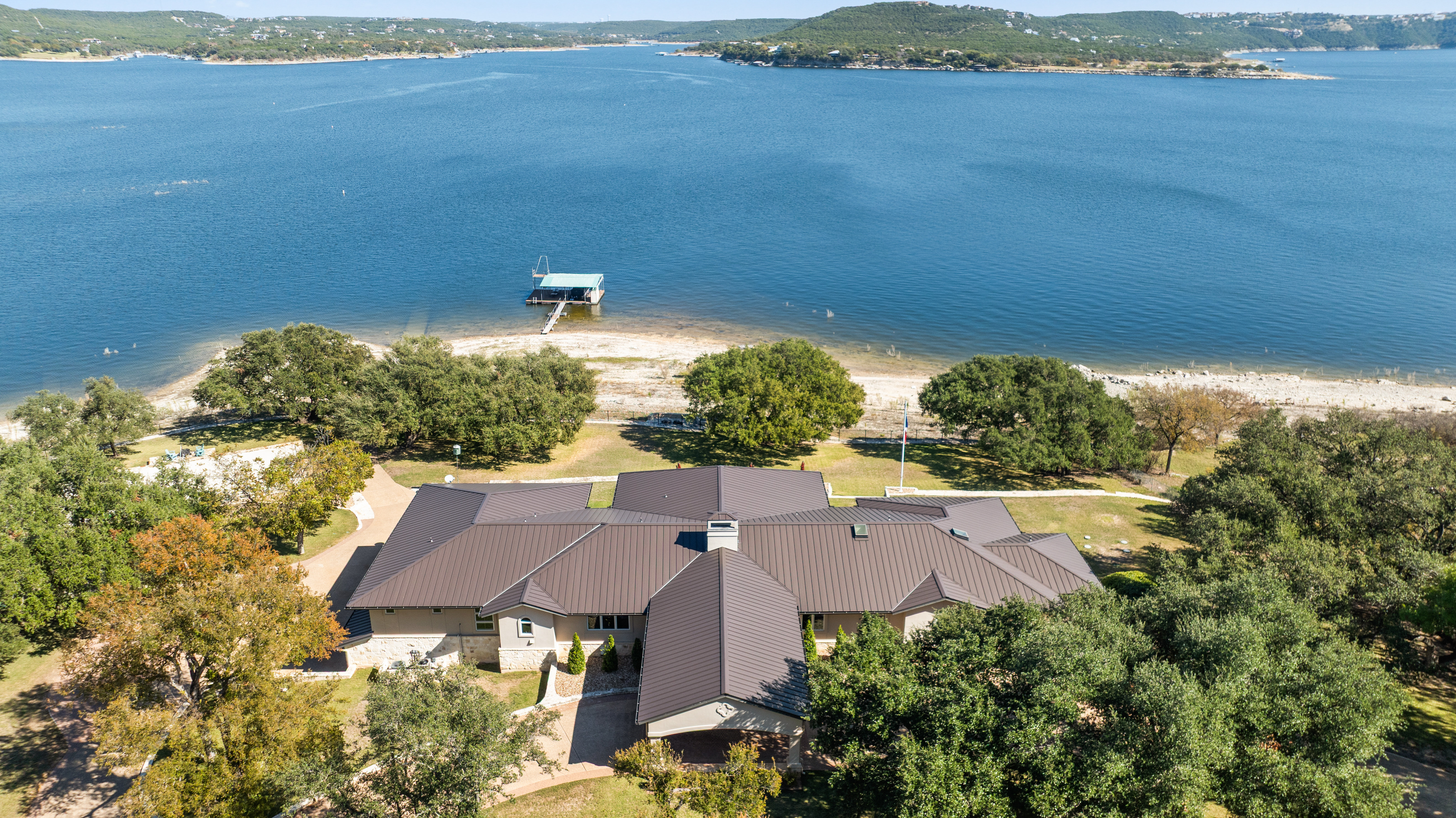 15210 Rainbow 1 Street Austin, TX 78734 - Photo 34 of 138 an aerial view of a house with a yard and lake view