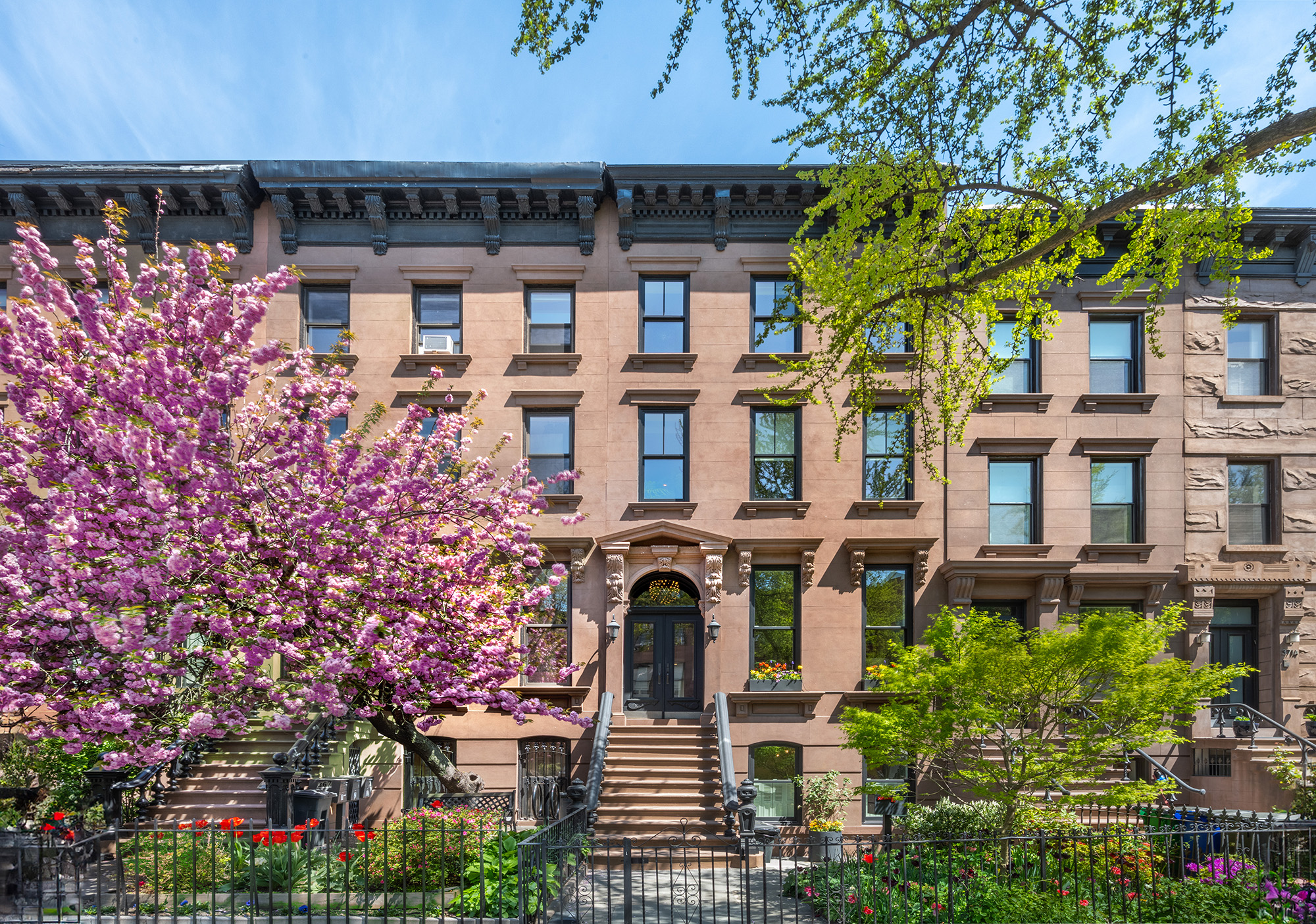 front view of a building with a garden