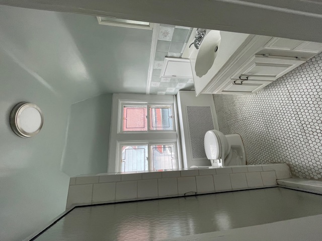 340 Marlborough Road Brooklyn, NY 11226 - Photo 24 of 27 a bathroom with a sink a toilet a window and vanity