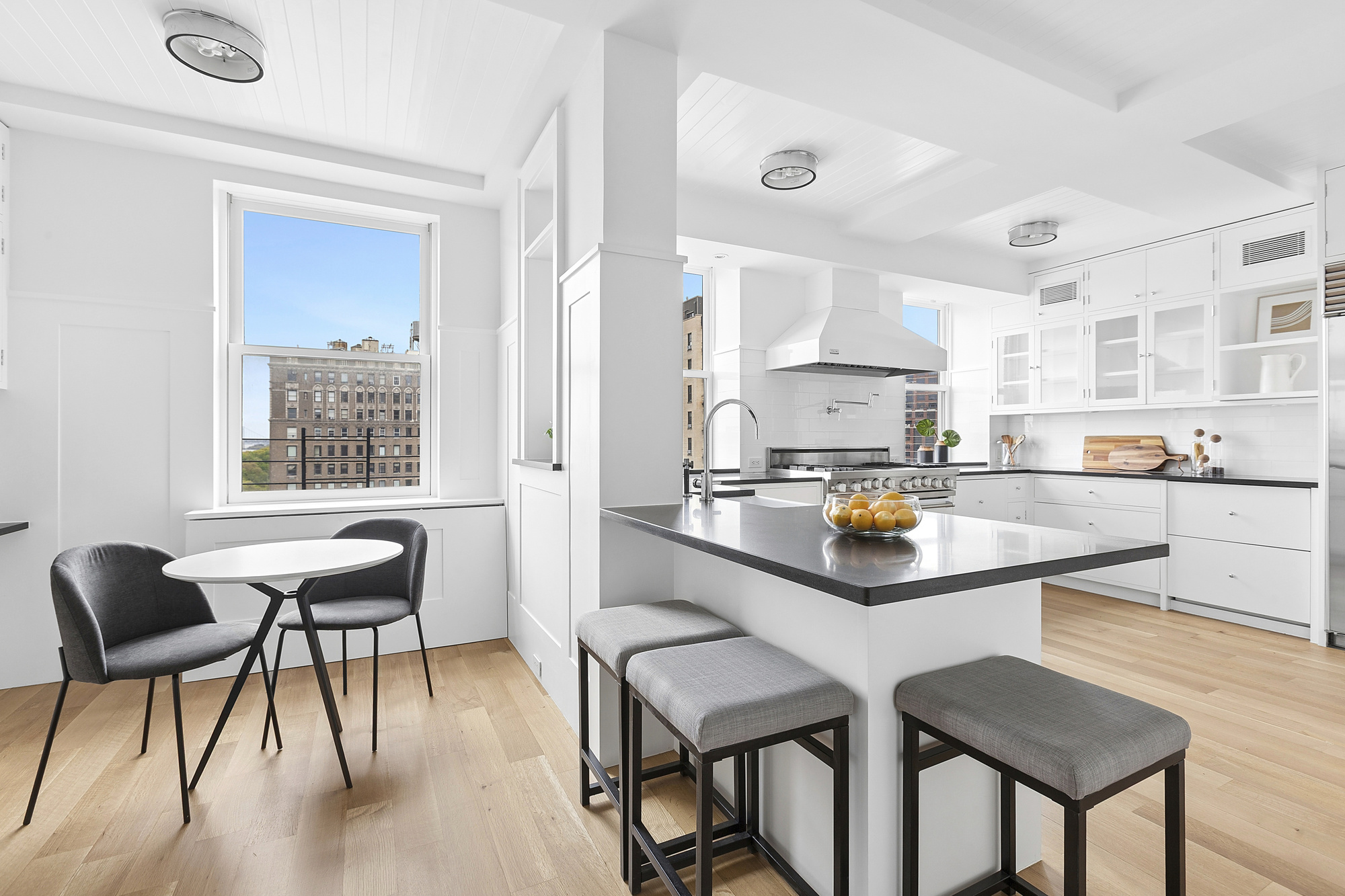 325 Riverside Drive, Unit 111 Manhattan, NY 10025 - Photo 5 of 13 a kitchen with a dining table chairs and window
