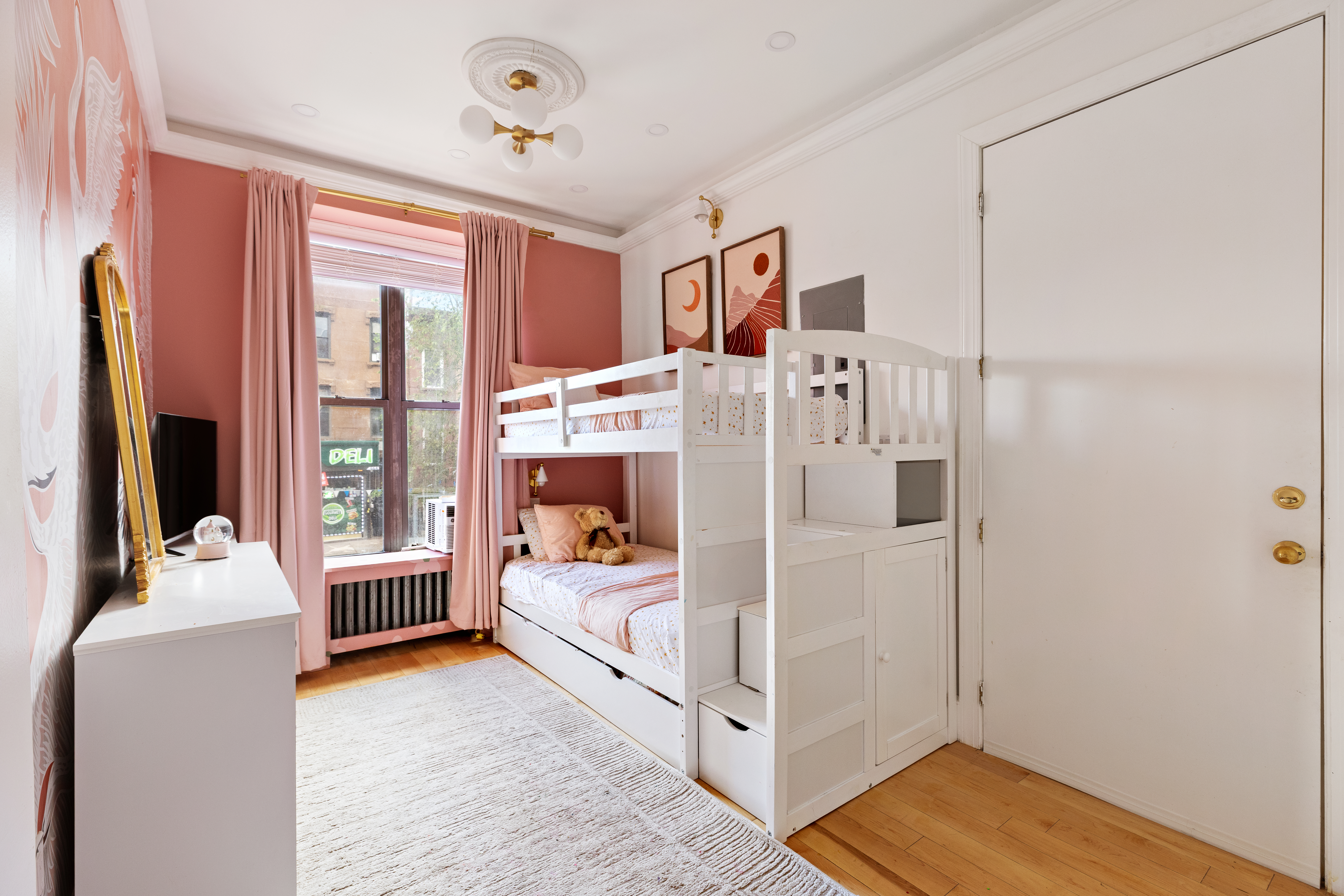 663 Greene Avenue Brooklyn, NY 11221 - Photo 2 of 14 a bed room with a bed and a chair