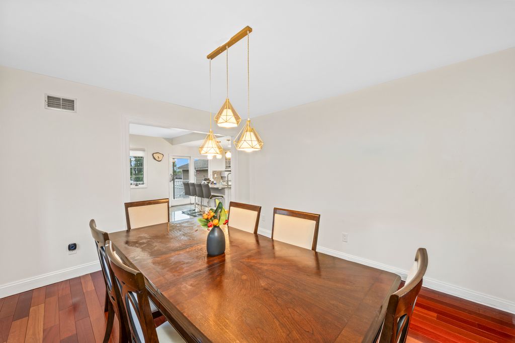79 Sparkill Avenue Staten Island, NY 10304 - Photo 11 of 32 a view of a dining room with furniture and wooden floor