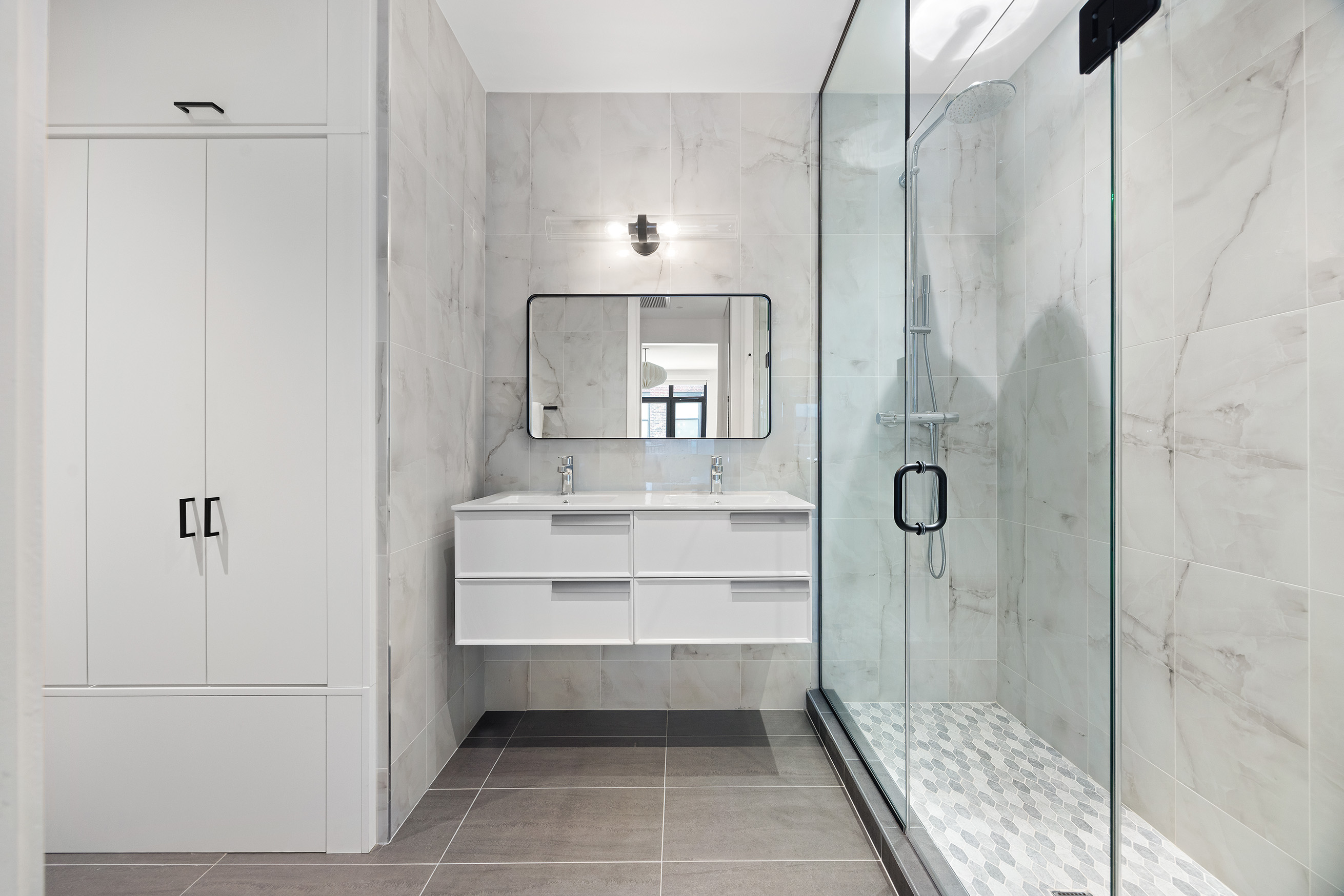 128 West 26th Street, Unit PH Manhattan, NY 10001 - Photo 12 of 21 a bathroom with a mirror and a shower