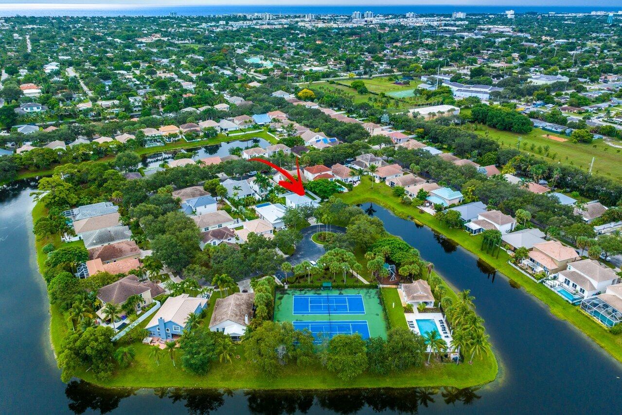 1182 Canoe Point Delray Beach, FL 33444 - Photo 39 of 46 an aerial view of residential houses with outdoor space and trees all around