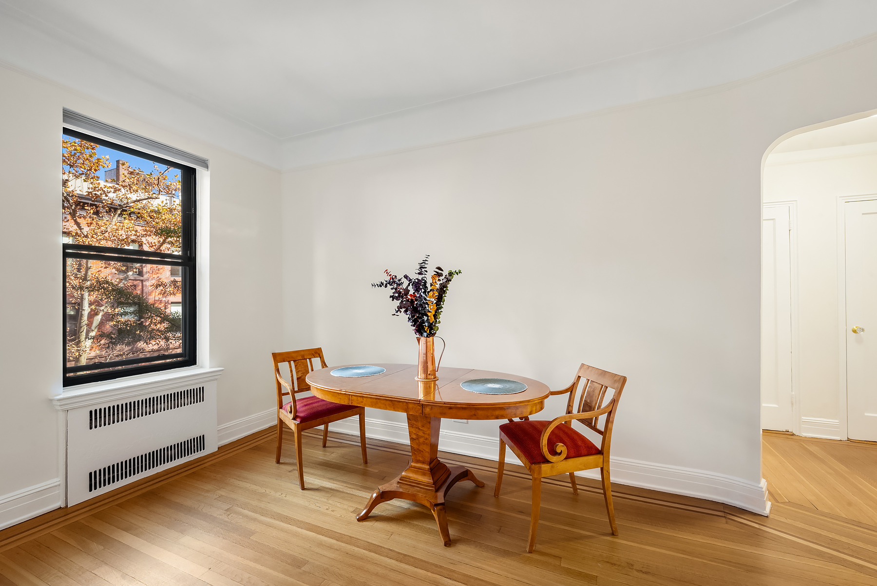 124 East 91st Street, Unit 3D Manhattan, NY 10128 - Photo 3 of 11 a view of a livingroom with furniture and wooden floor