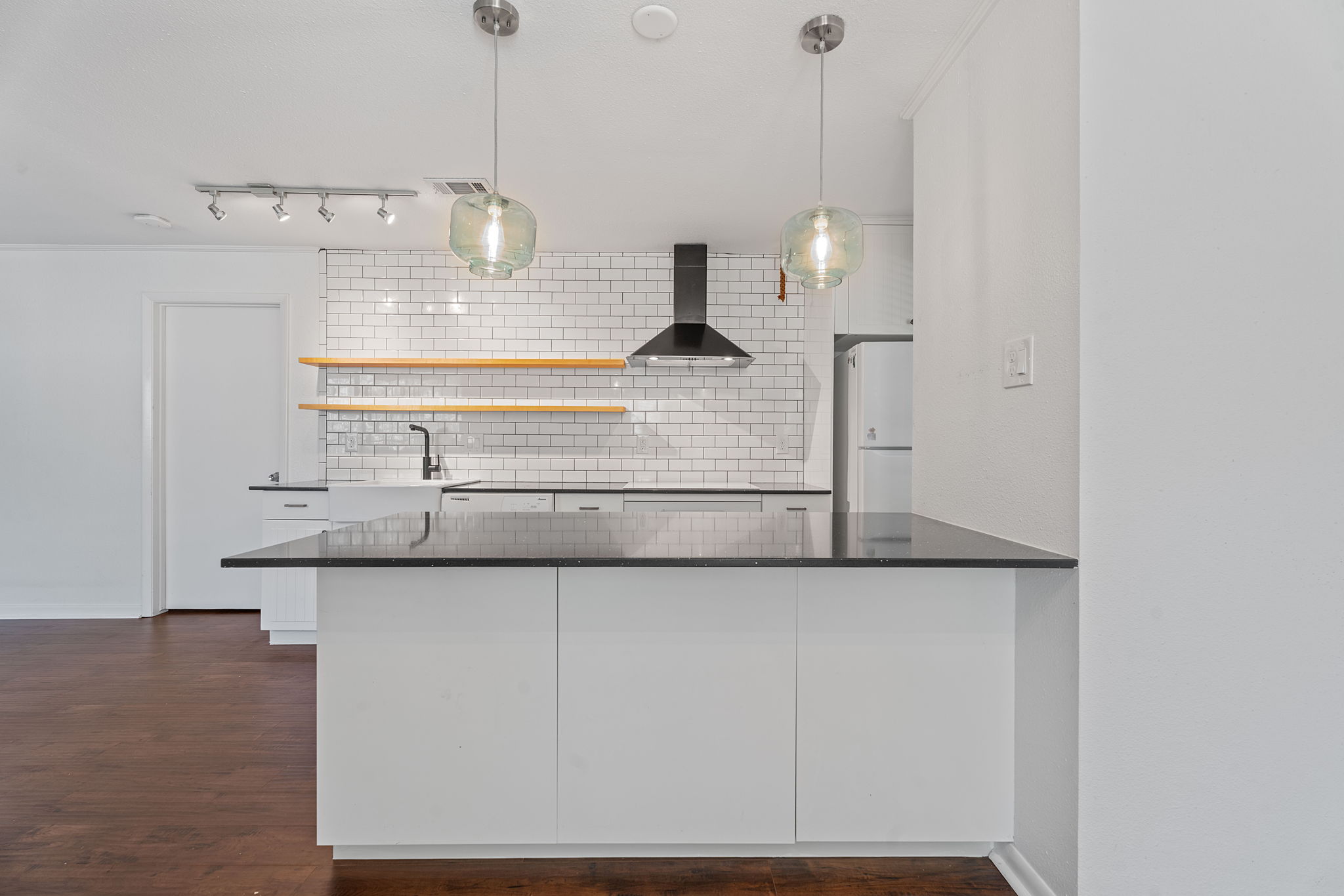 1510 West N Loop Boulevard, Unit 424 Austin, TX 78756 - Photo 3 of 25 a kitchen with stainless steel appliances granite countertop a sink a stove and a refrigerator