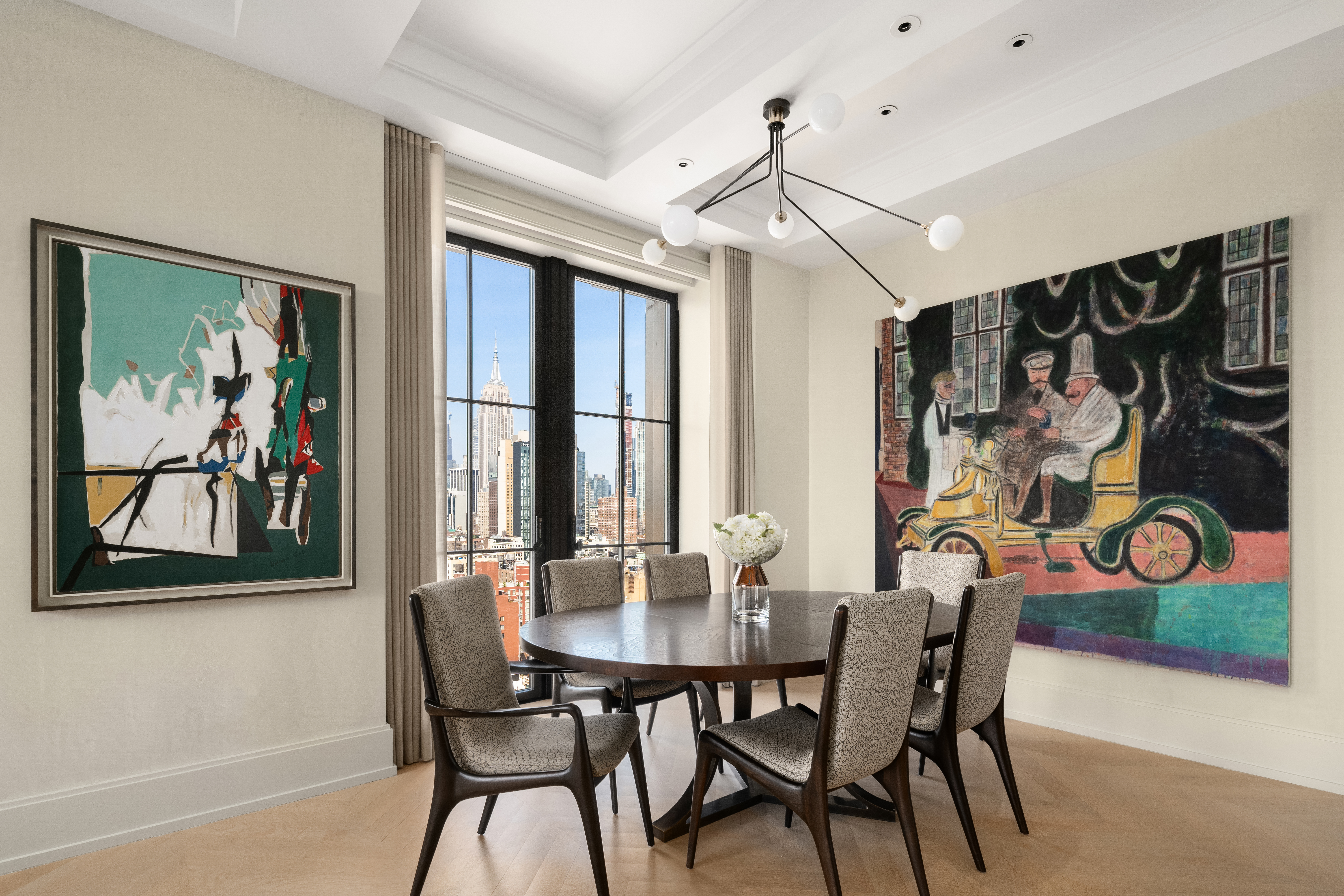 212 West 18th Street, Unit 19C Manhattan, NY 10011 - Photo 5 of 27 a view of a dining room with furniture window and wooden floor