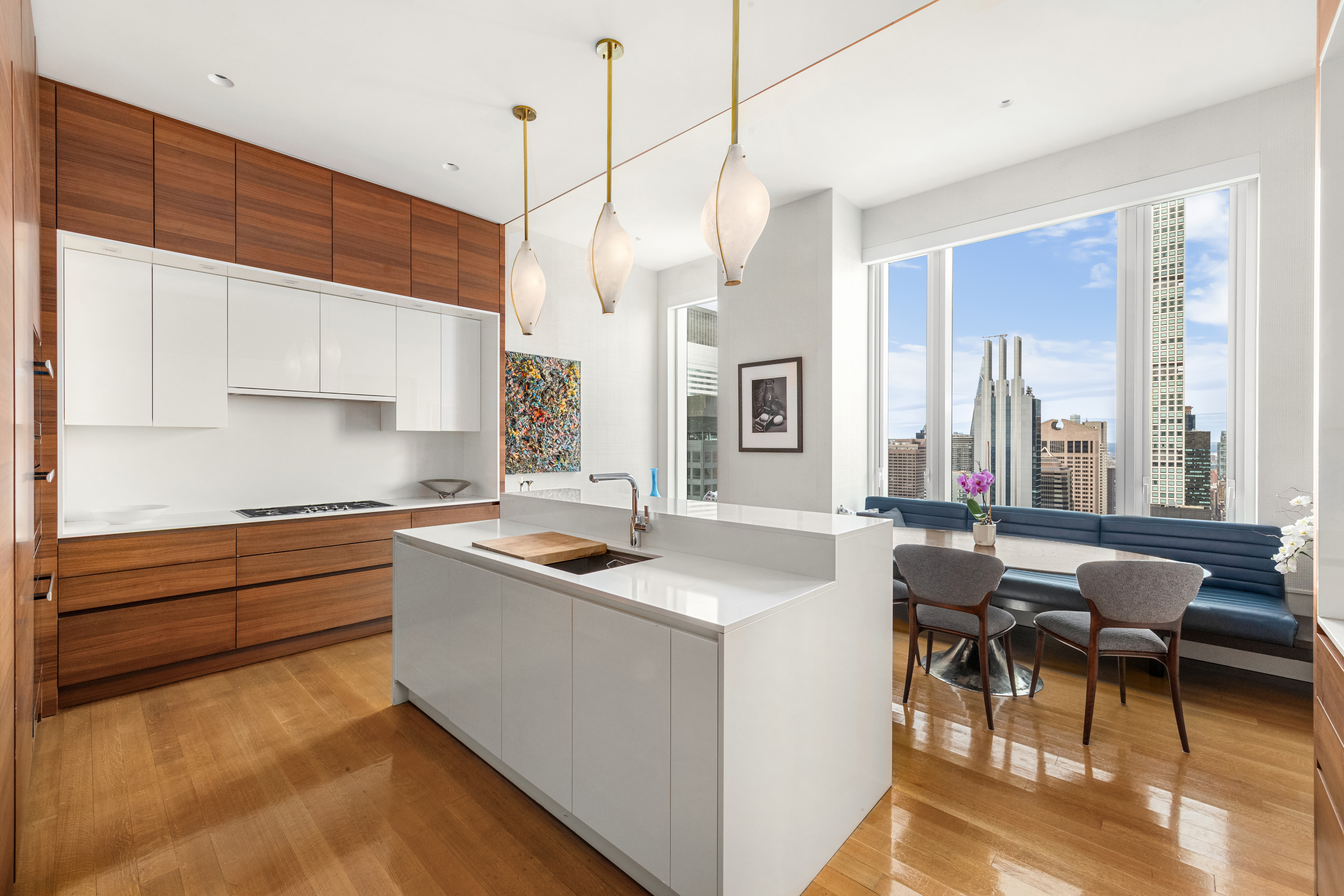 252 East 57th Street, Unit 60A Manhattan, NY 10022 - Photo 9 of 28 a kitchen that has a sink and a stove in it