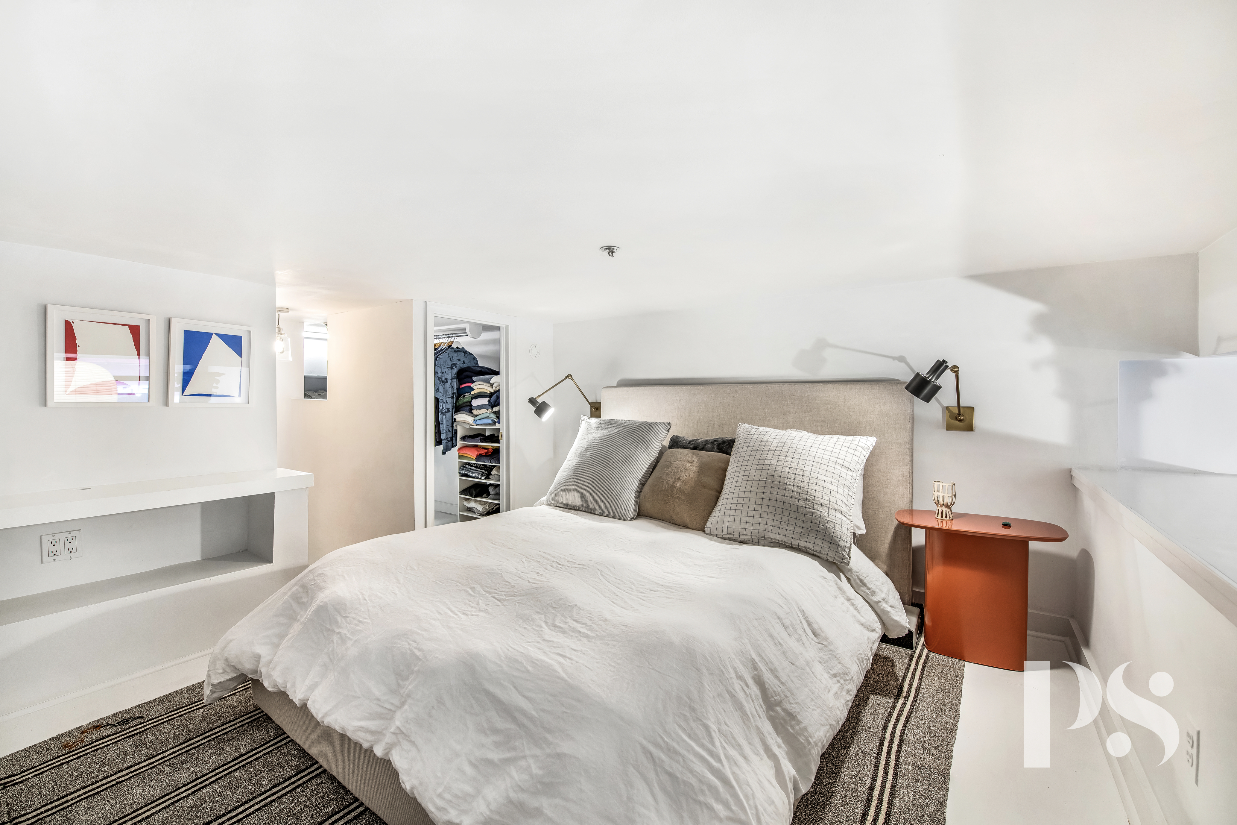 67 East 11th Street, Unit 517 Manhattan, NY 10003 - Photo 8 of 13 a large white bed in a white room