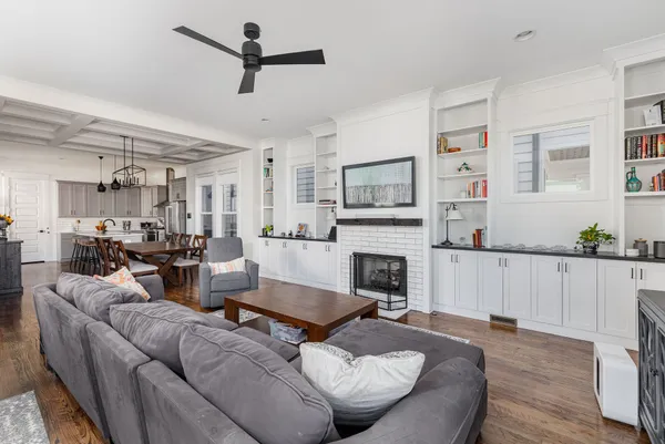 a kitchen with refrigerator cabinets and wooden floor
