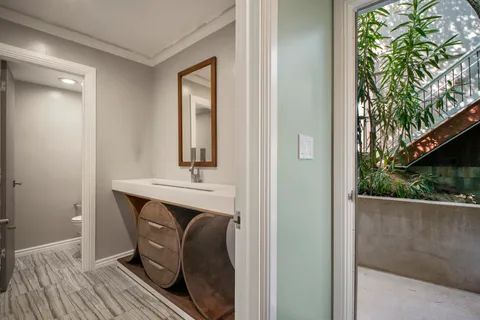 a room with a sink and a mirror