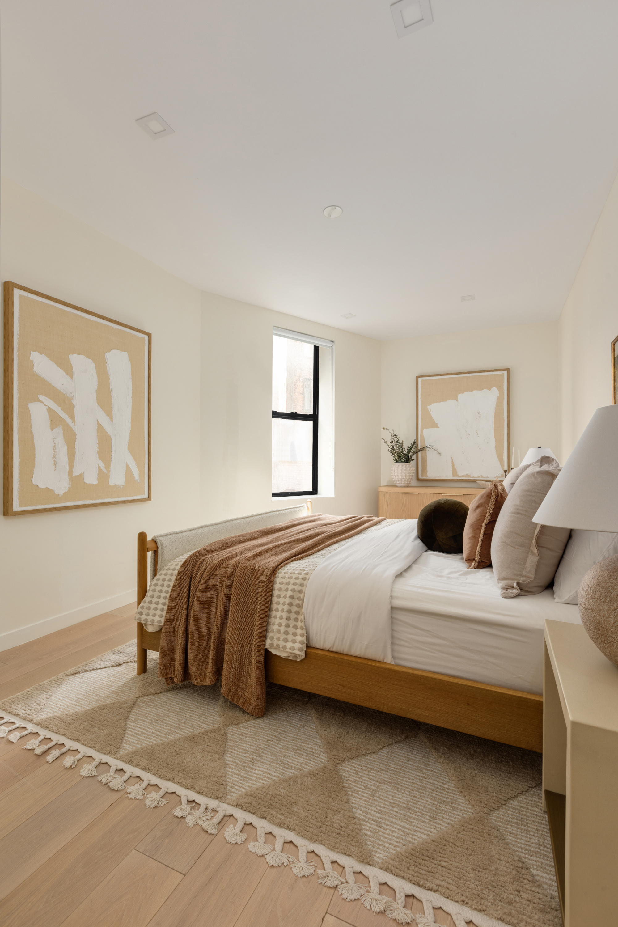 112 Hudson Street, Unit 3 Manhattan, NY 10013 - Photo 5 of 11 a bedroom with a bed and wooden floor