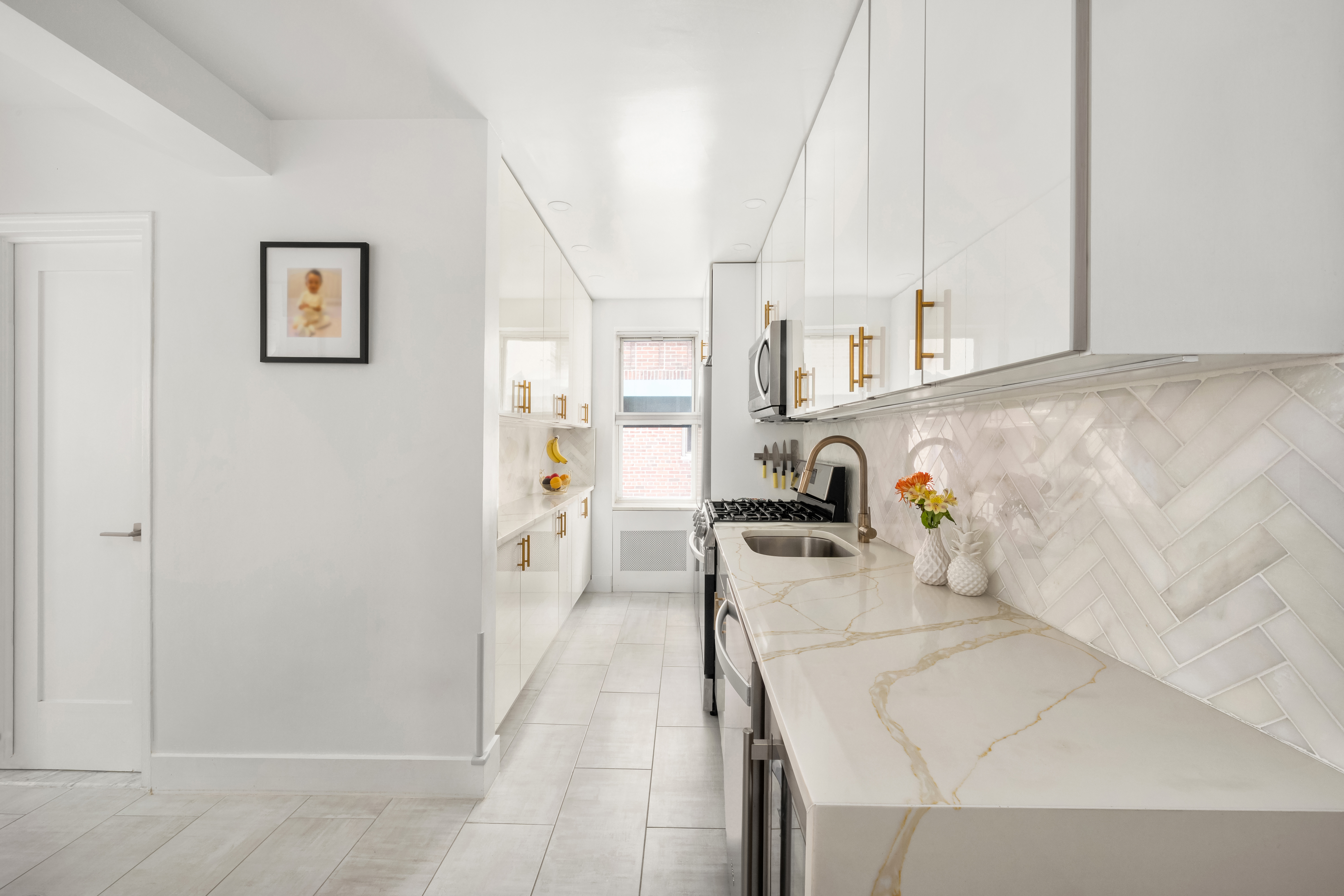 325 East 77th Street, Unit 1E Manhattan, NY 10075 - Photo 2 of 8 a view of living room with furniture and floor to ceiling window