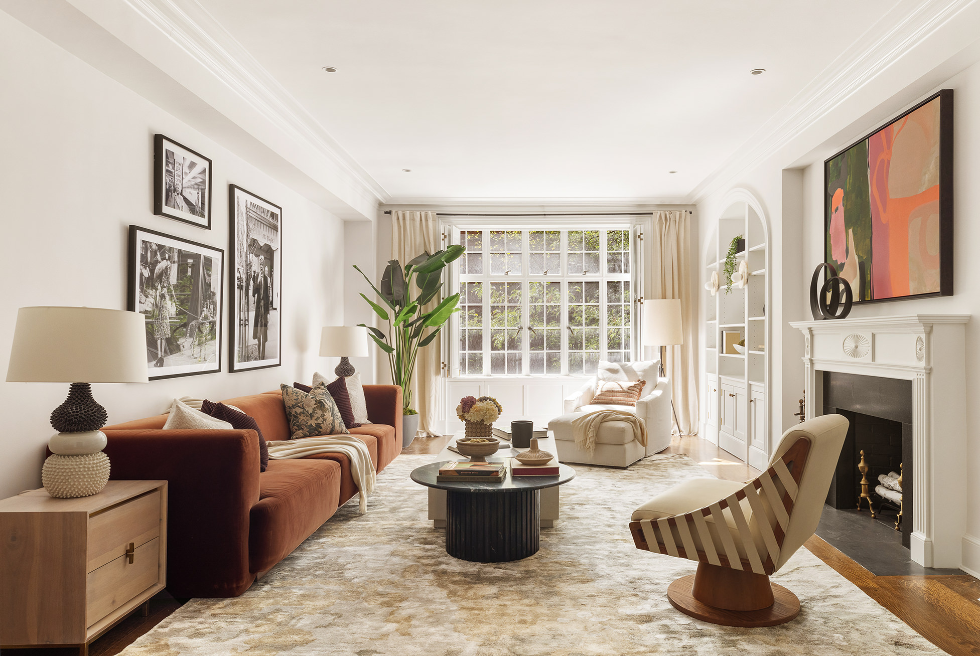 a living room with furniture and fireplace