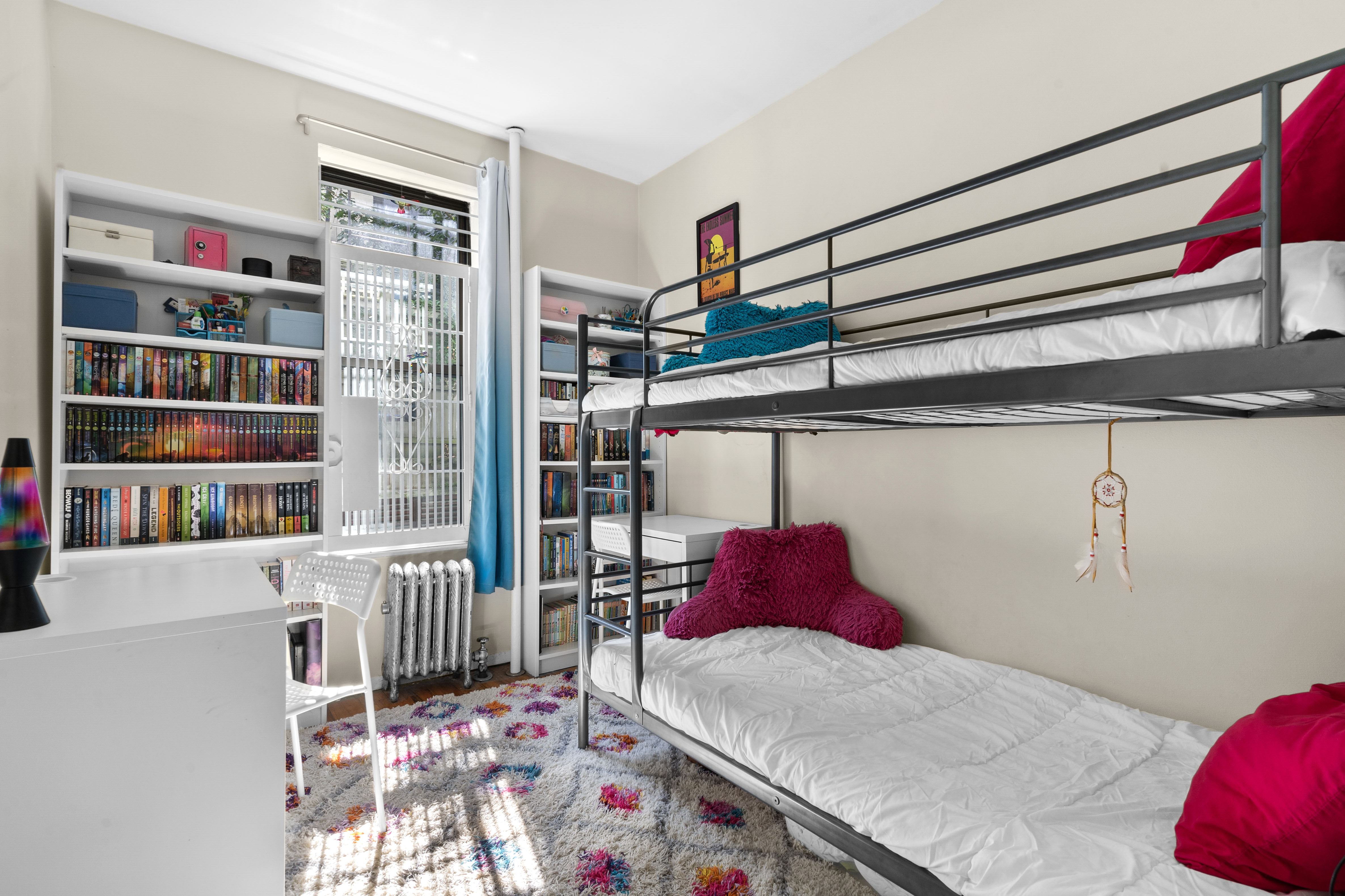 456 15th Street, Unit 1R Brooklyn, NY 11215 - Photo 7 of 14 a utility room with dryer and book shelf