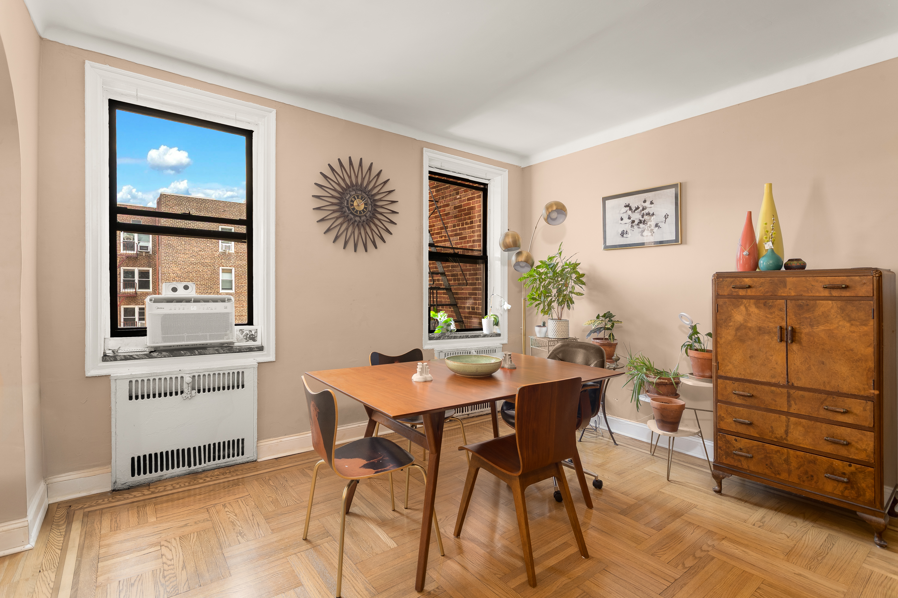 35-06 88th Street, Unit 5DD Queens, NY 11372 - Photo 8 of 18 a workspace with furniture and window