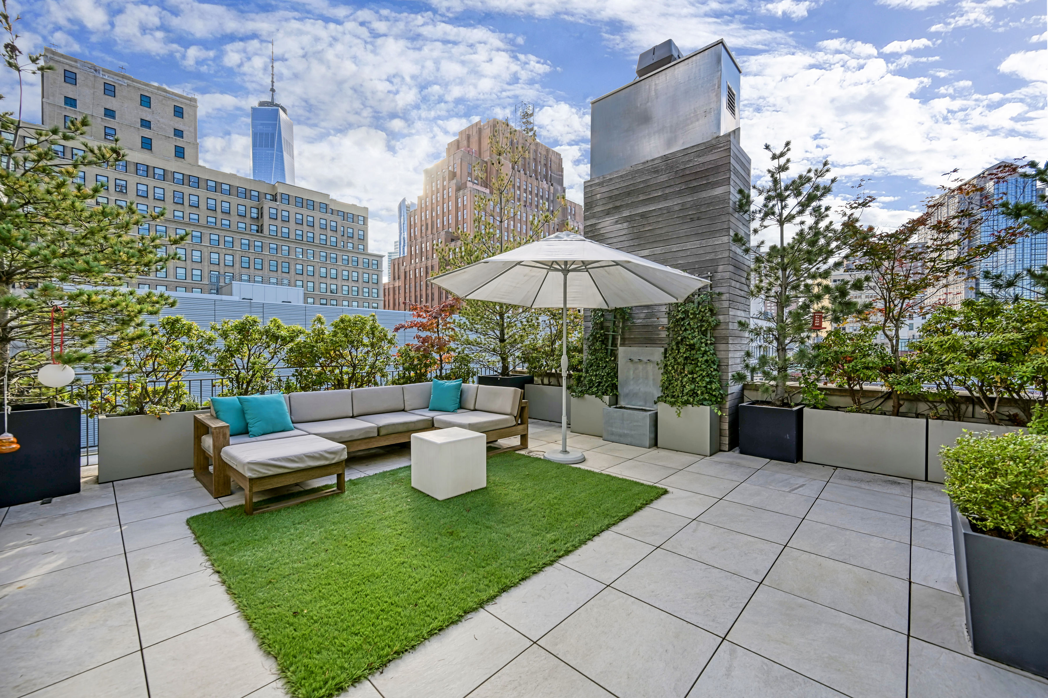 53 Leonard Street, Unit PH Manhattan, NY 10013 - Photo 10 of 24 a view of a patio with couches and potted plants