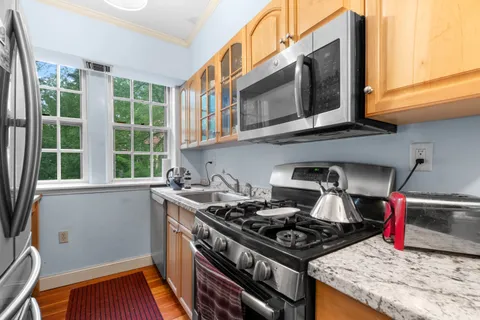 a kitchen with a stove and a microwave
