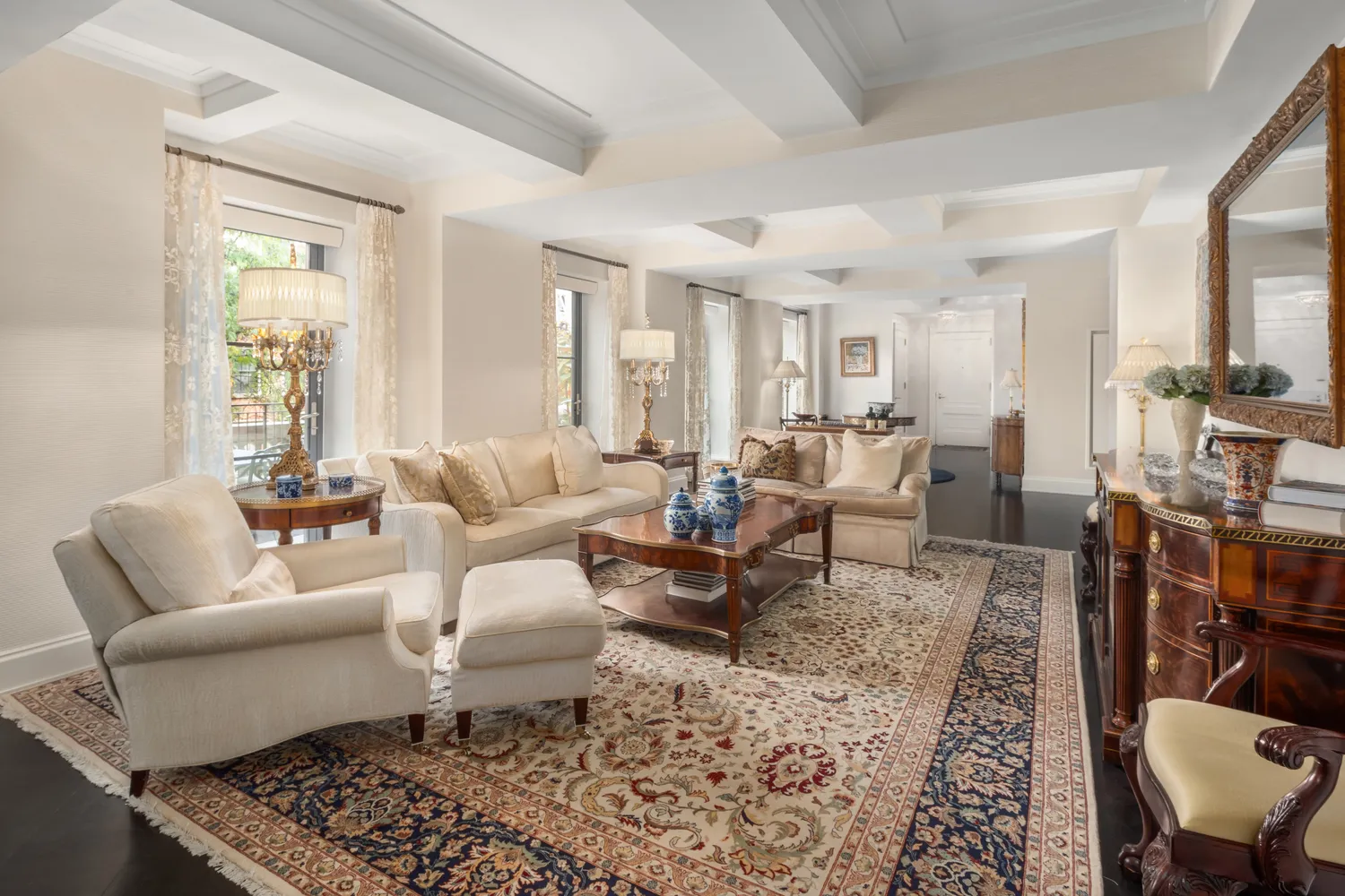 a living room with furniture a rug and a window
