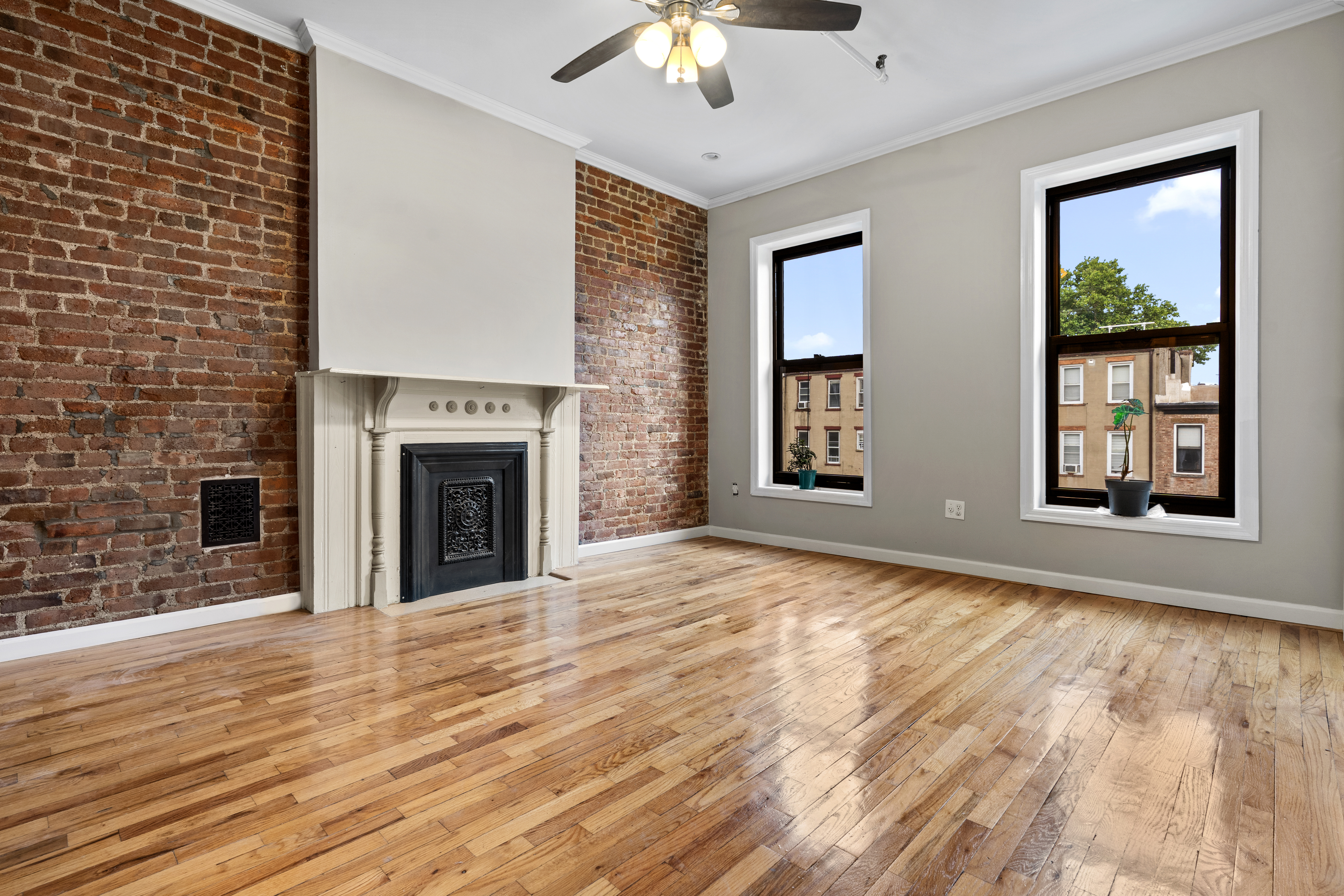 615 Putnam Avenue, Unit 4 Brooklyn, NY 11221 - Photo 2 of 10 a view of an empty room with window and wooden floor